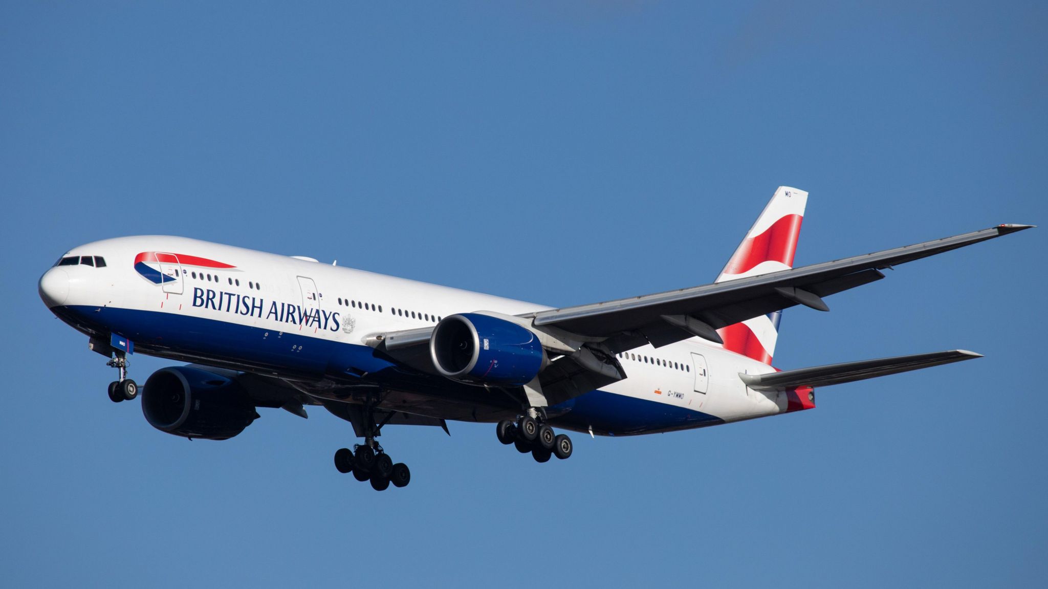 British Airways 777 airliner against a blue sky