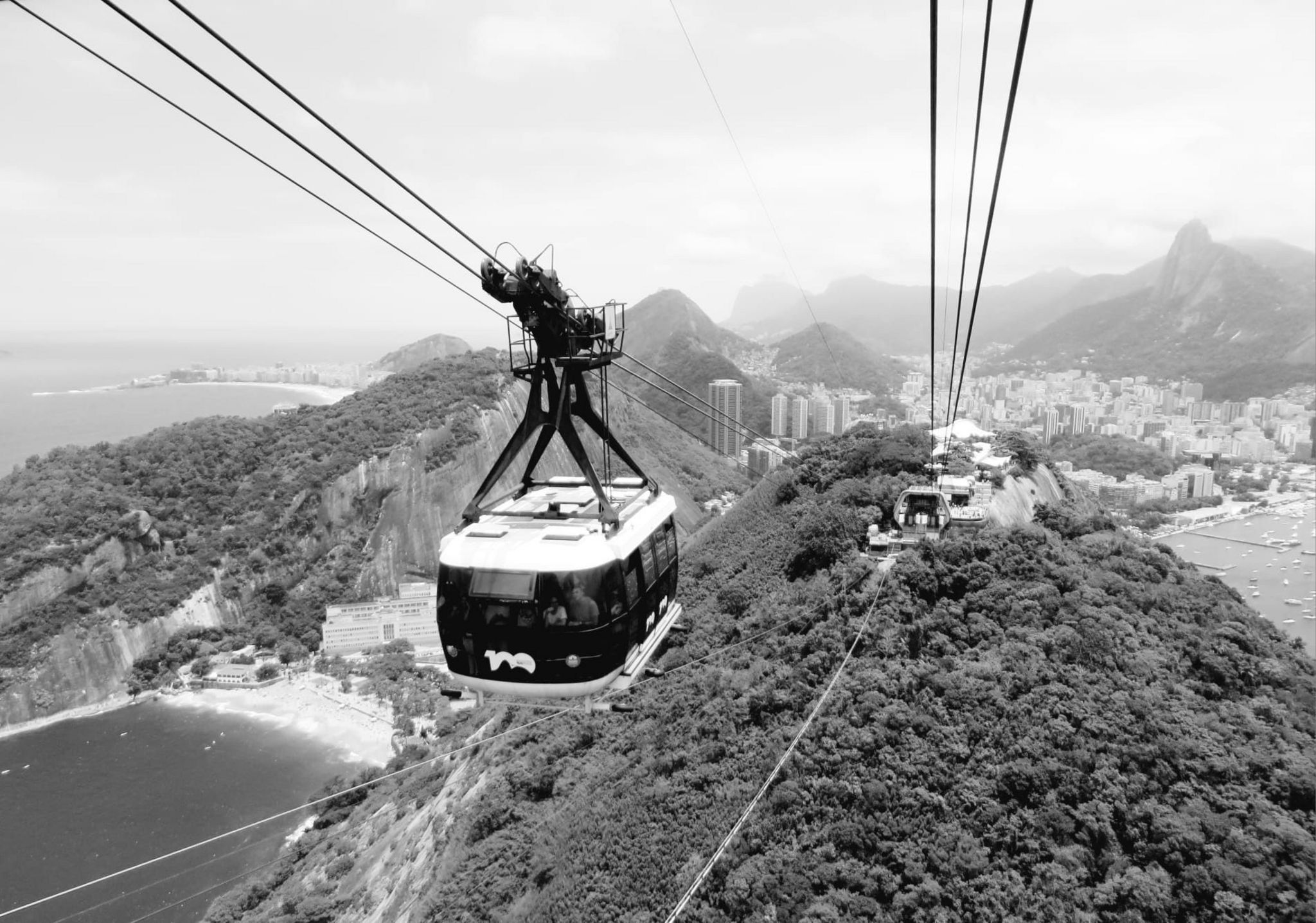 A cable car travelling between the city of Rio de Janeiro and Sugarloaf Mountain