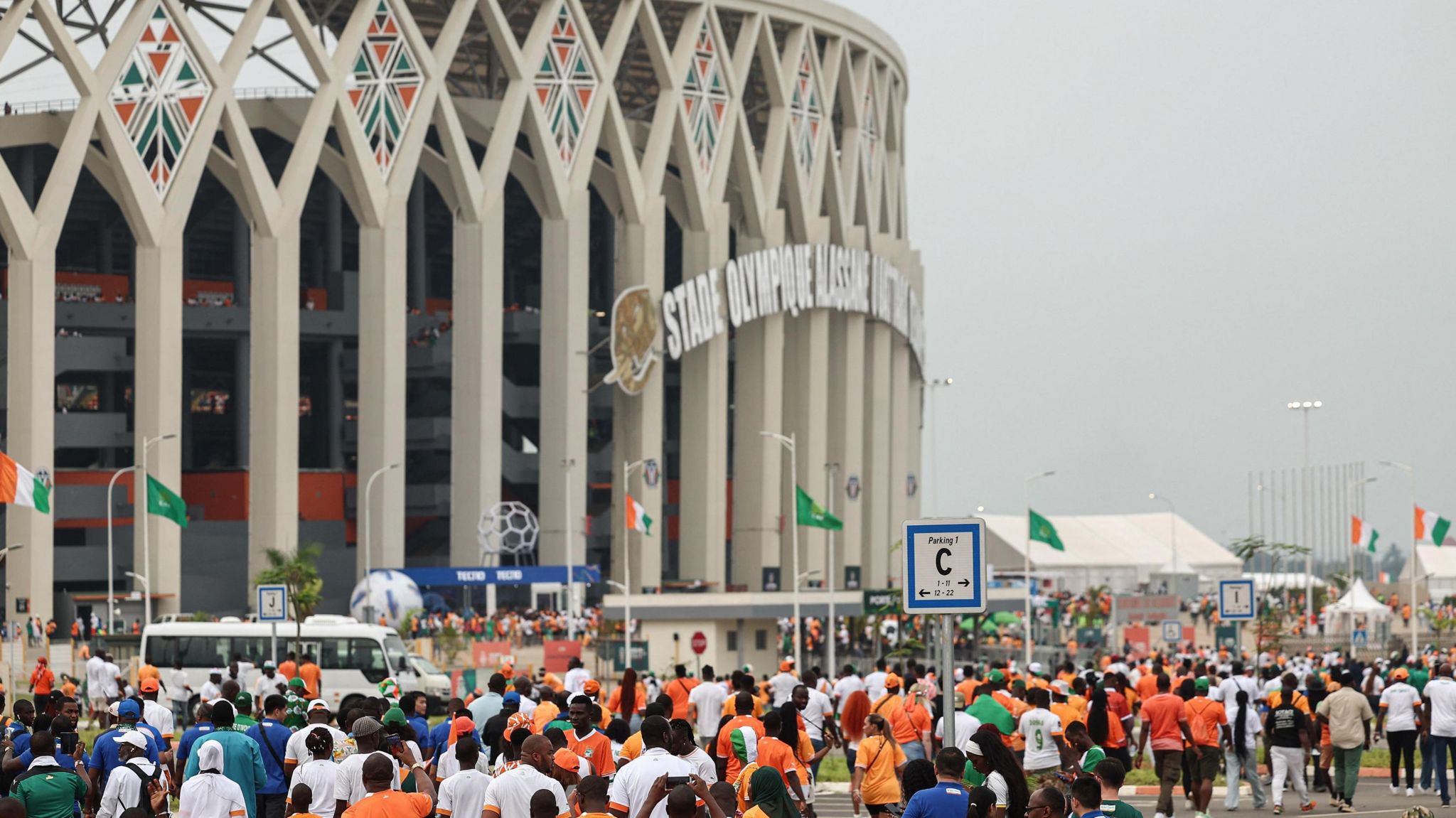 Fans head to the Alassane Ouattara Stadium ahead of a game at the 2023 Africa Cup of Nations