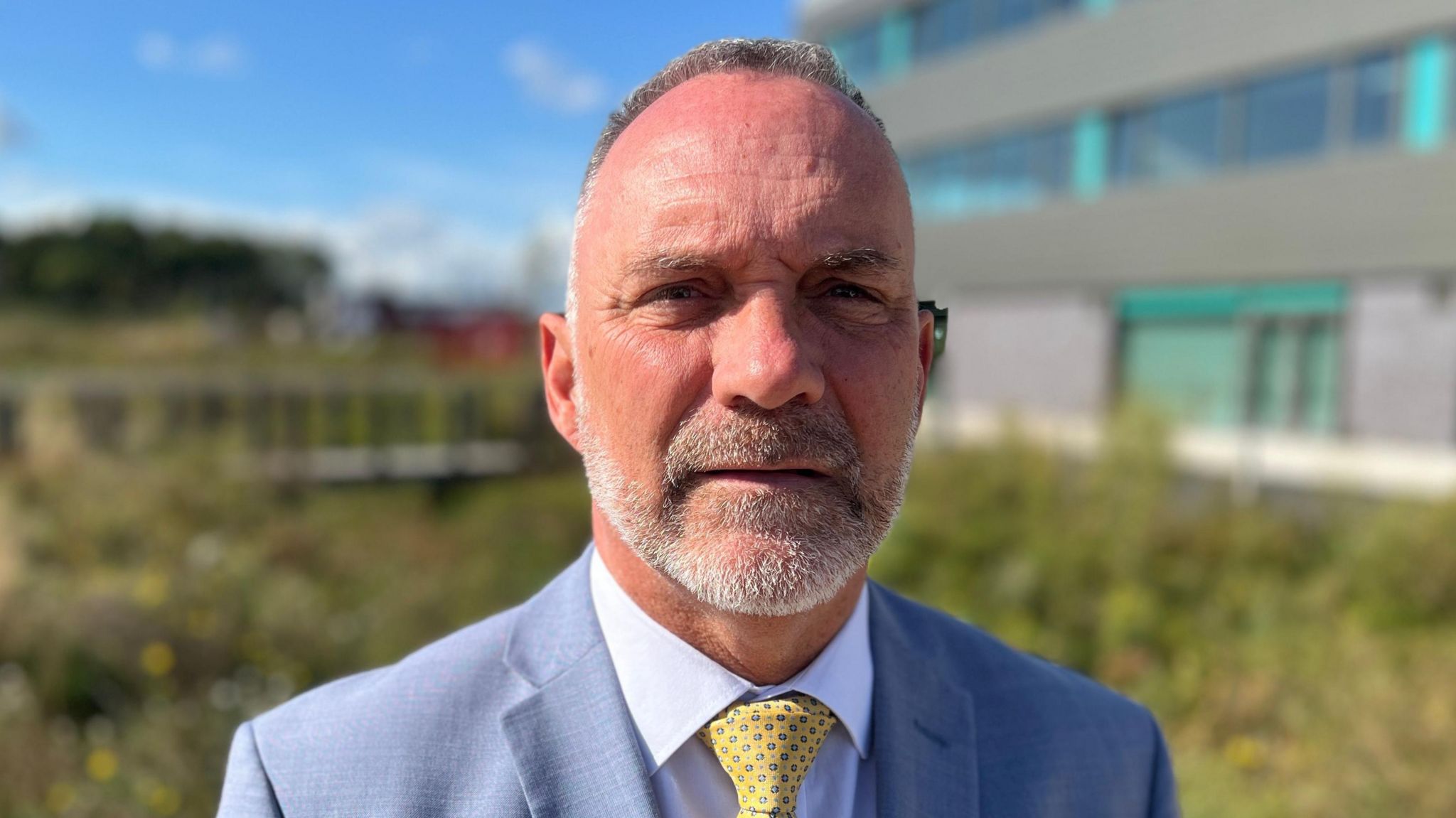 Thurrock Council leader Andrew Jefferies in a close up image. He is wearing a light blue suit and yellow tie