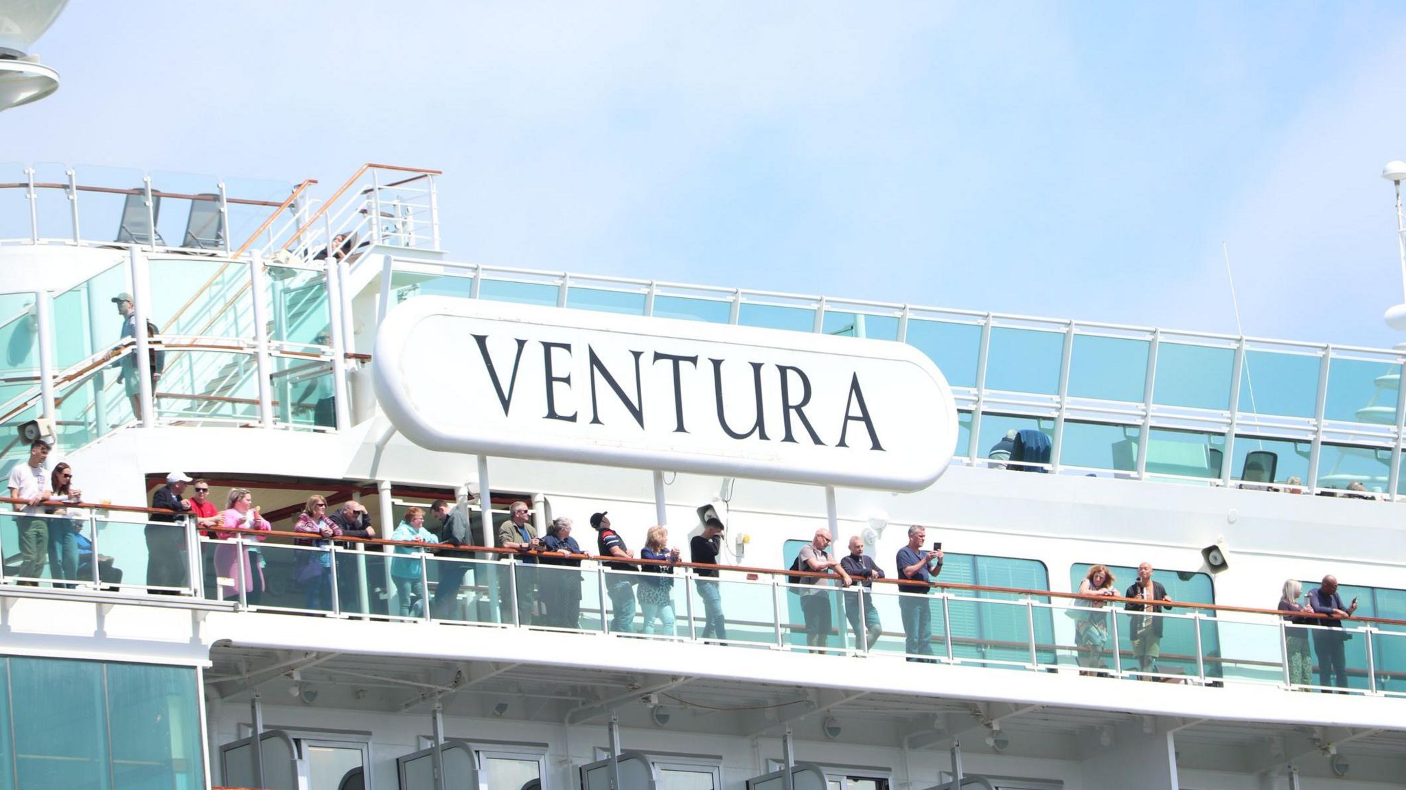 Passengers standing on top deck of Ventura