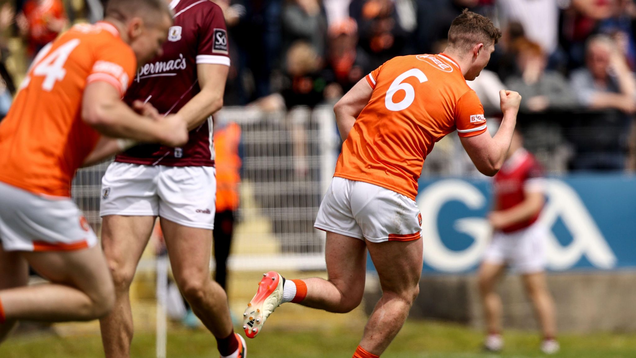 Tiernan Kelly wheels away in celebration after his goal