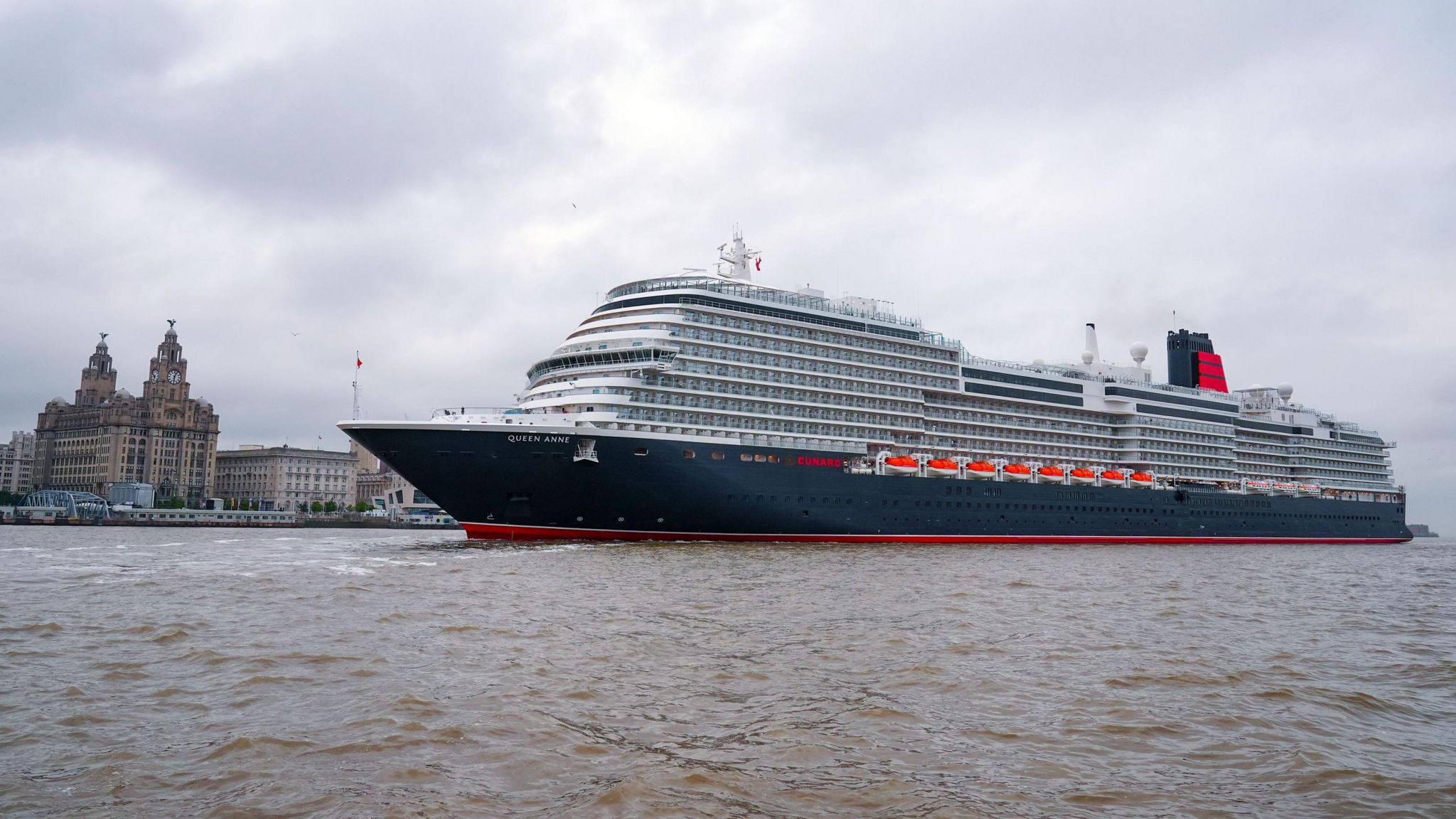 Cunard's Queen Anne sailing into the Mersey ahead of a naming ceremony at Liverpool Pier Head