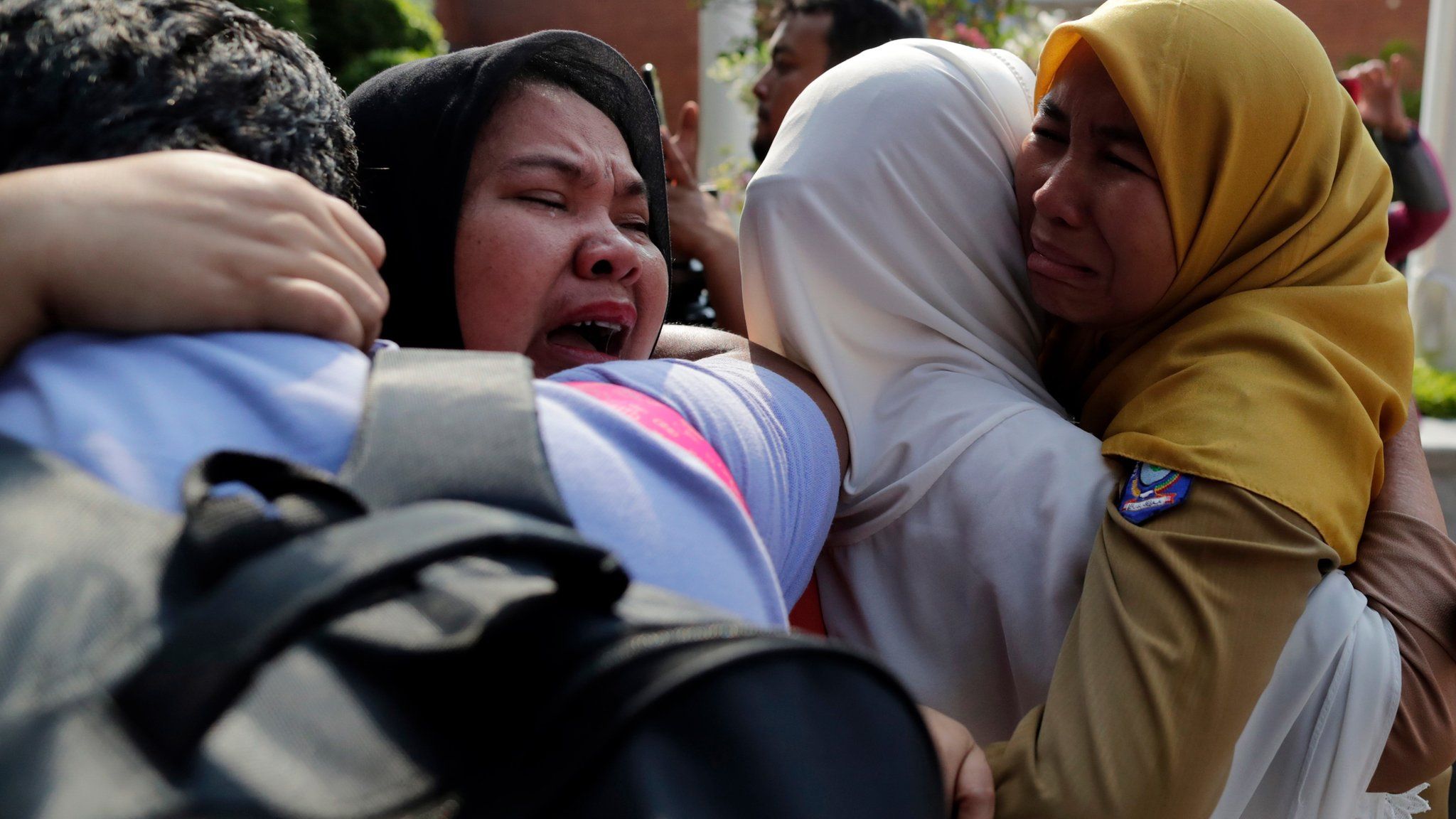 Indonesian relatives of the plane crash victims cry as they wait for the news at the airport in Sukarno Hatta Airport, Indonesia, 29 October 2018.