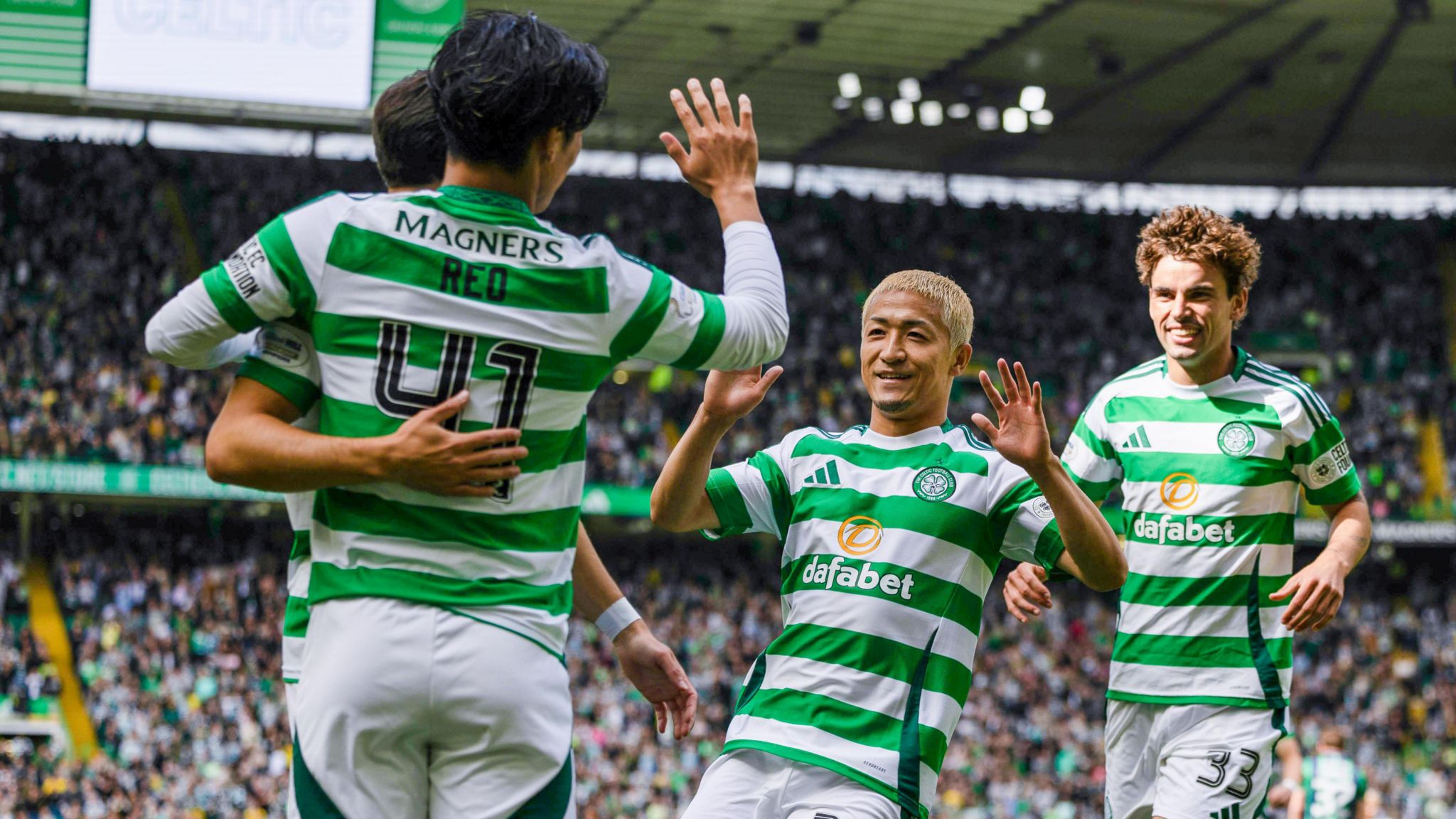 Celtic's Daizen Maeda celebrates with Reo Hatate after scoring to make it 1-0 during a Premier Sports Cup last sixteen match between Celtic and Hibernian at Celtic Park