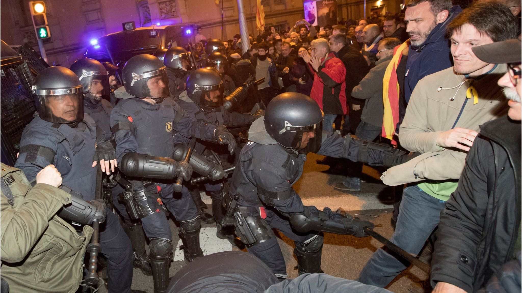 Catalonian riot police clash with protesters at the headquarters of the Spanish Government Delegation in Barcelona, 23 March 2018