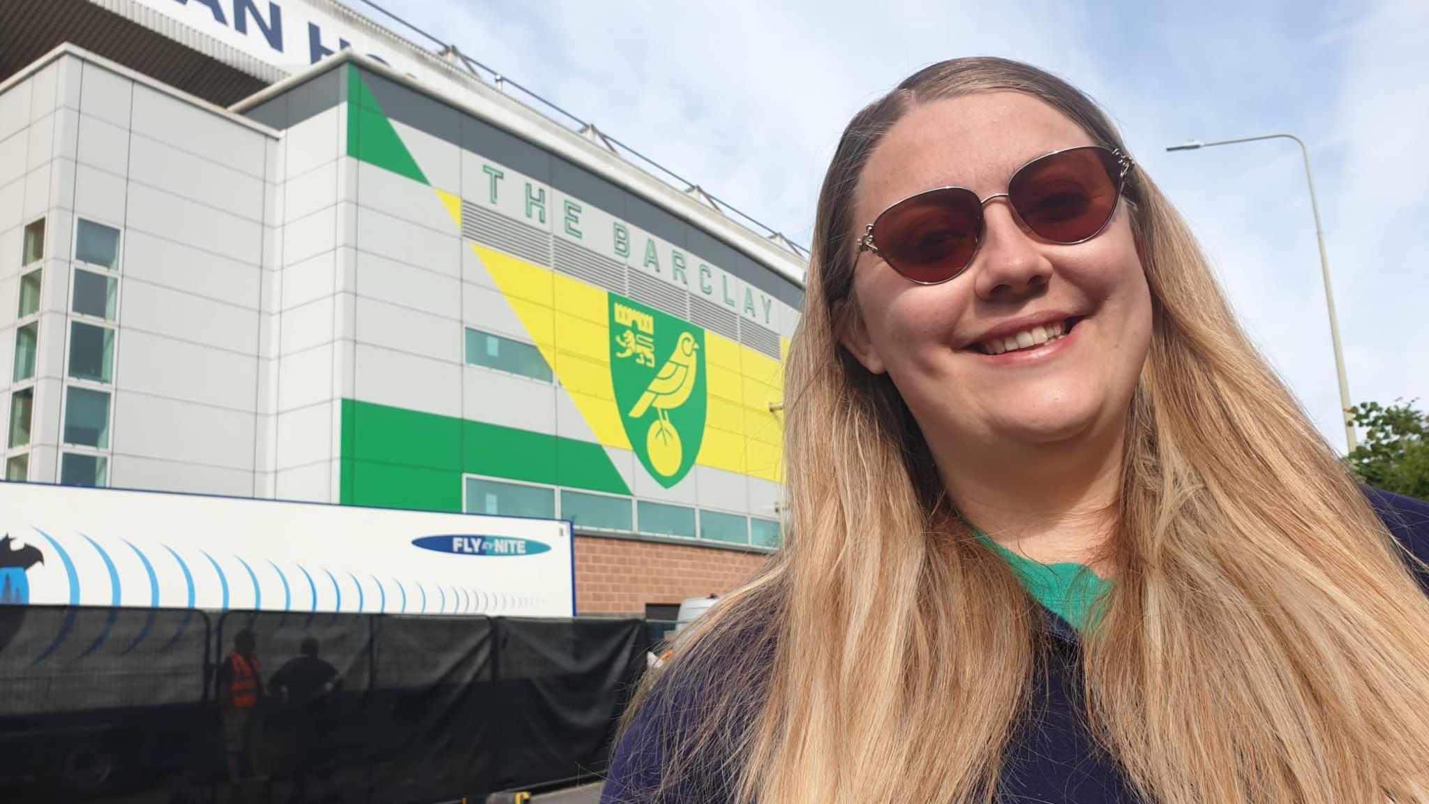 Ciara Oakes smiling outside of Carrow Road stadium 