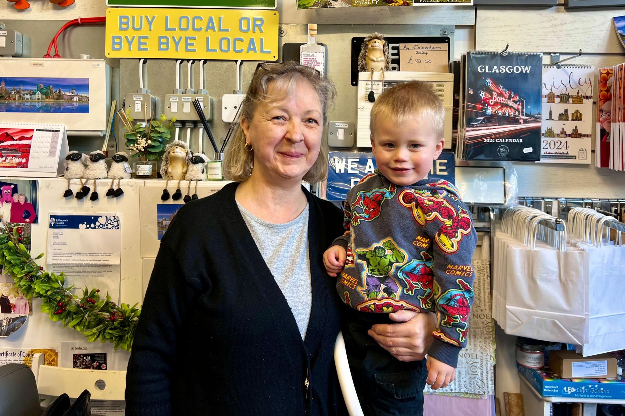 Elaine Fulton with her great-nephew in her store