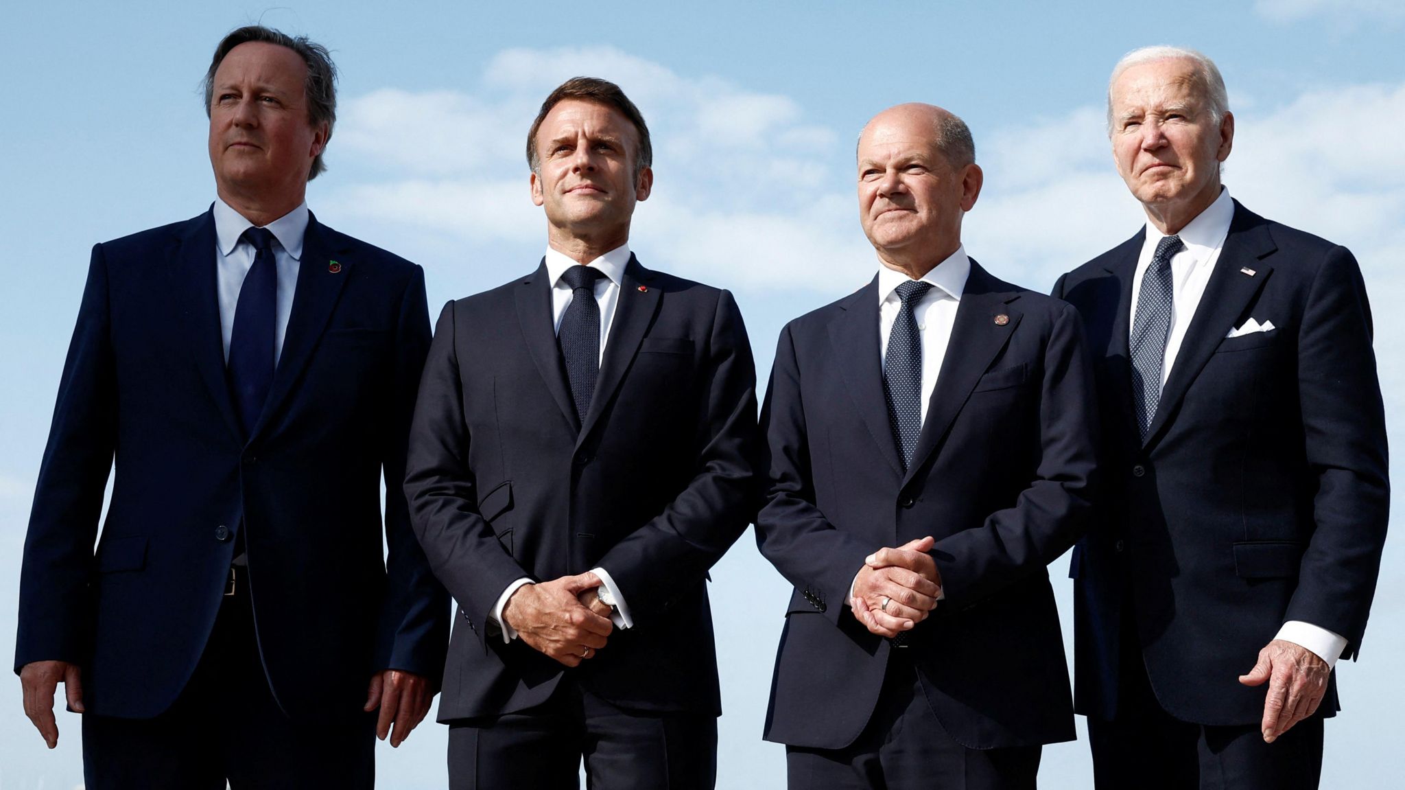Britain's Foreign Secretary David Cameron, French President Emmanuel Macron, German Chancellor Olaf Scholz and U.S. President Joe Biden attend the international ceremony marking the 80th anniversary of the 1944 D-Day landings and the liberation of western Europe from Nazi Germany occupation, at Omaha Beach in Saint-Laurent-sur-Mer,