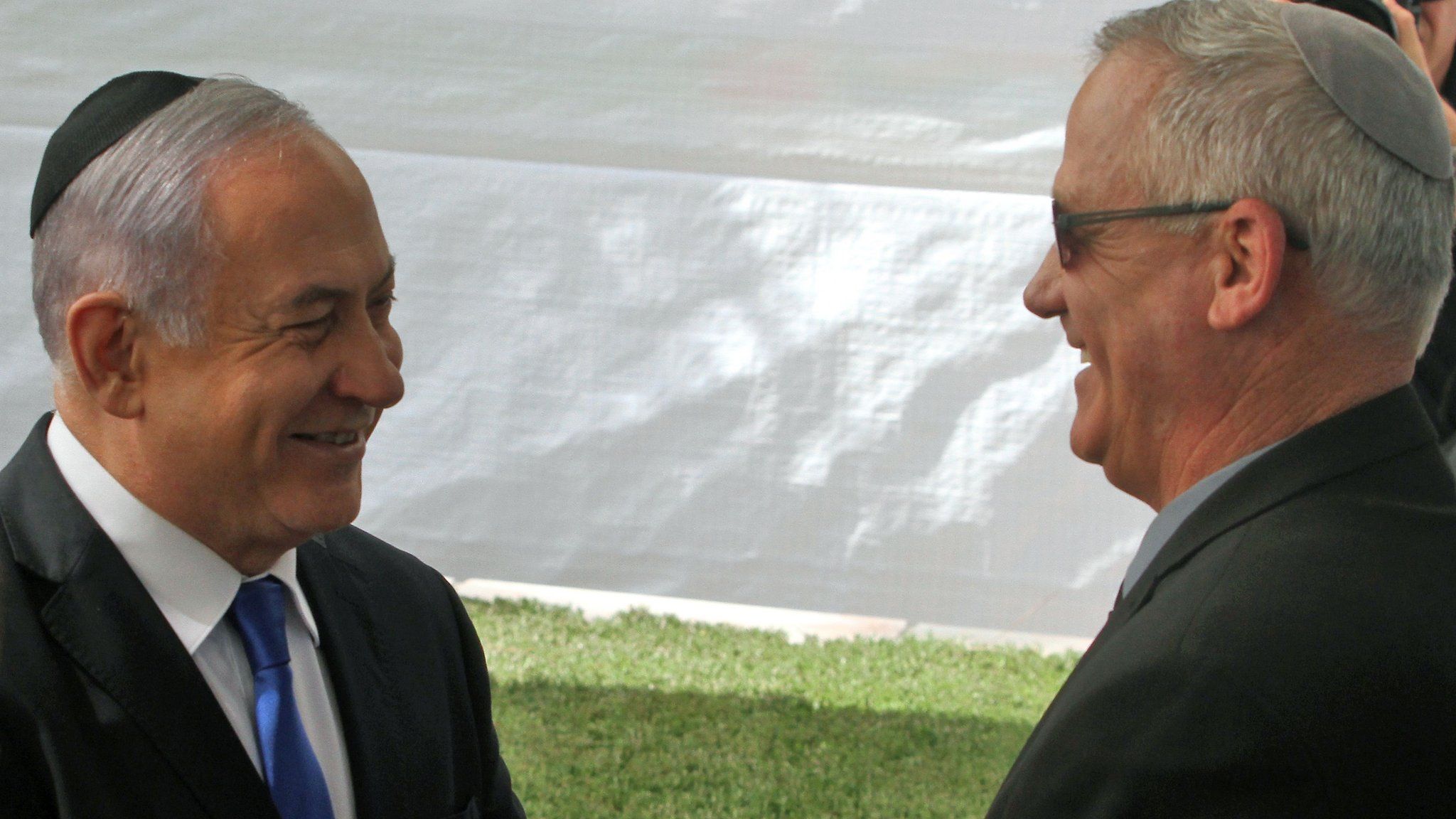 Benjamin Netanyahu shakes hands with Benny Gantz at Mount Herzl in Jerusalem on 19 September 2019