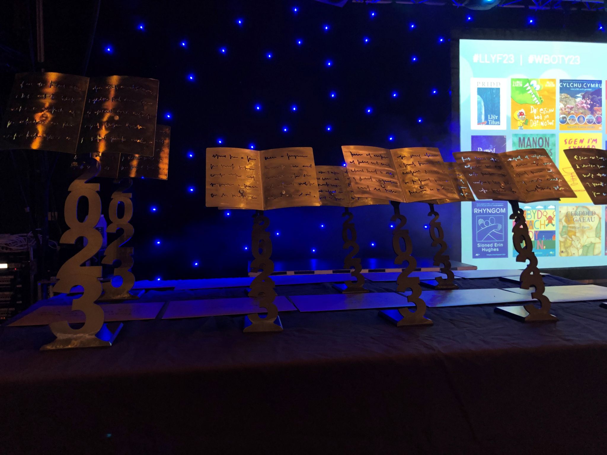 Wales Book of the Year 2023 trophies on a stage