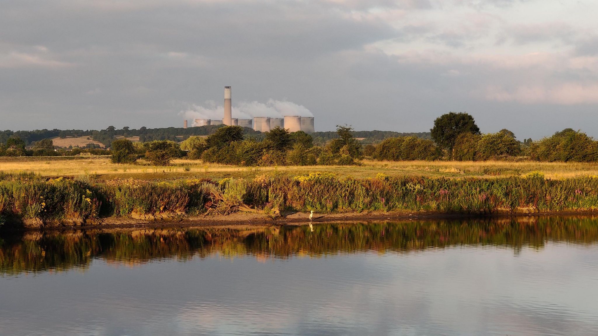 The river and banks of the River Trent, with Ratcliffe-on-Soar power station in the background