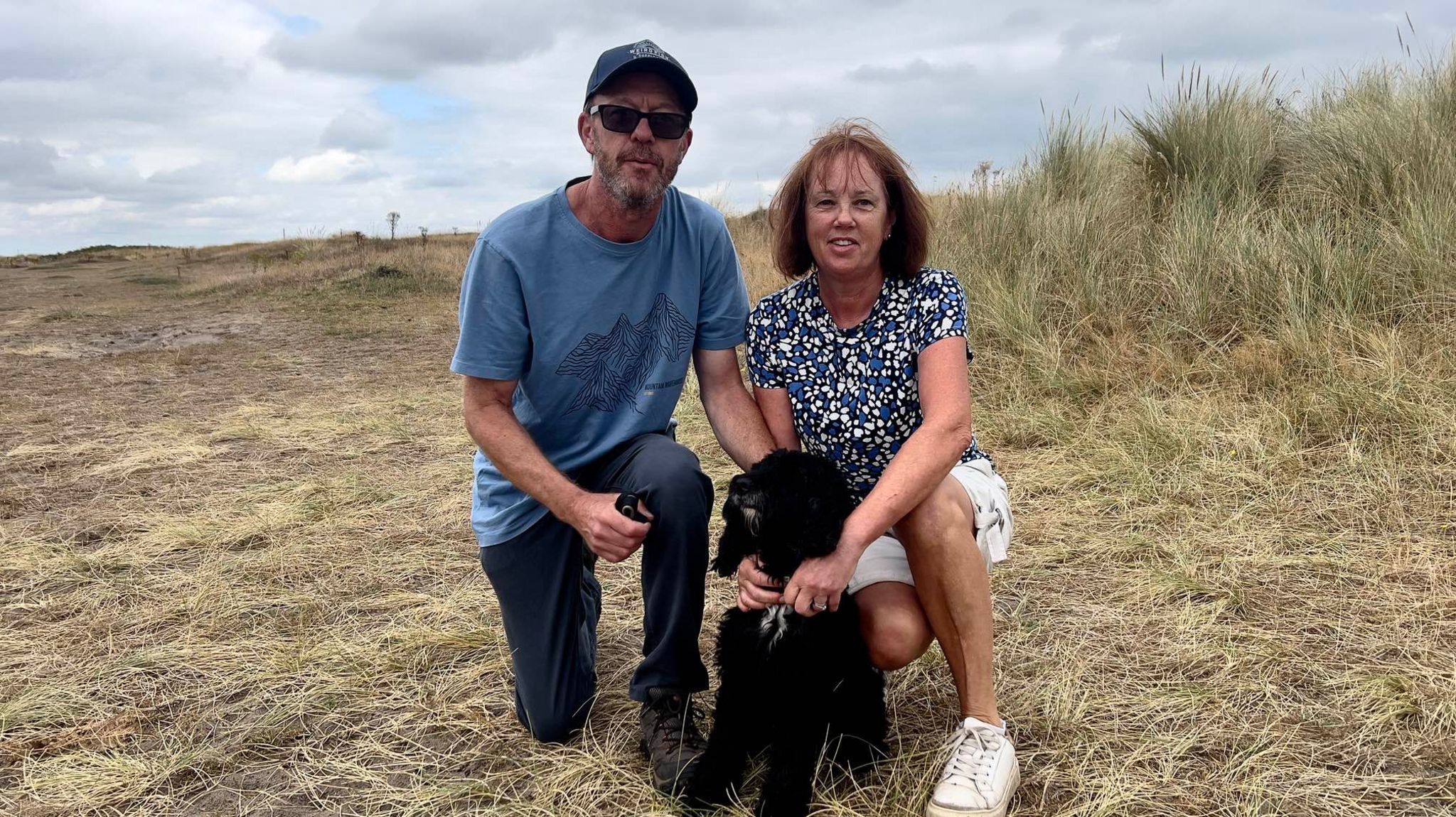 Tim Bennett and his partner with their dog at Sizewell beach