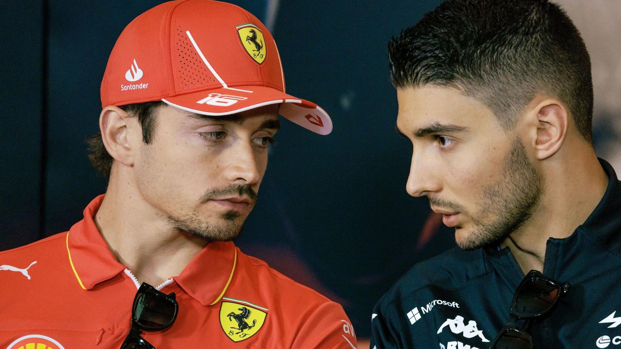 Ferrari's Charles Leclerc, left, and Esteban Ocon, of Alpine, in discussion ahead of the China Grand Prix