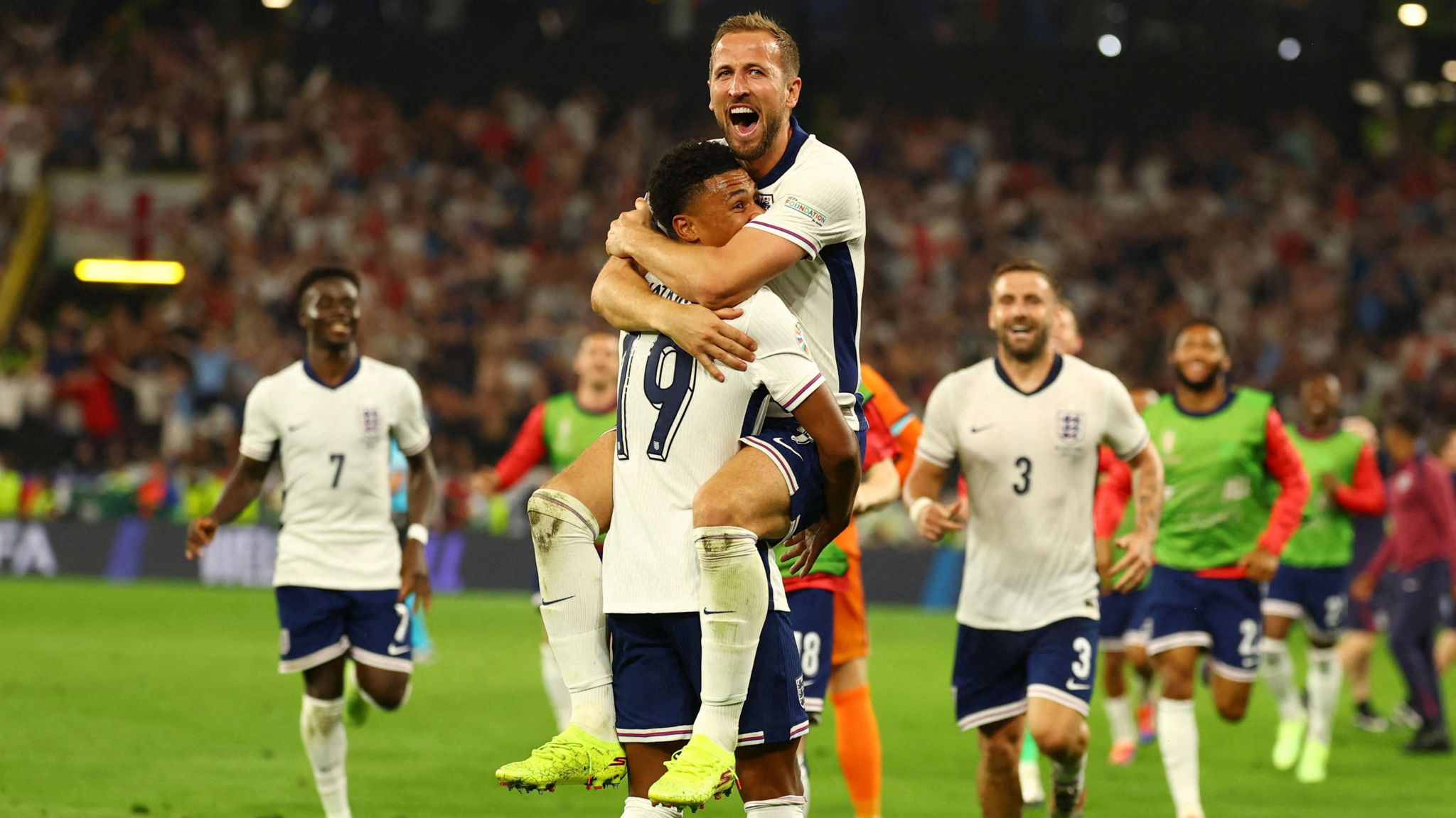 Harry Kane celebrates with England team-mate Ollie Watkins after the semi-final win against the Netherlands