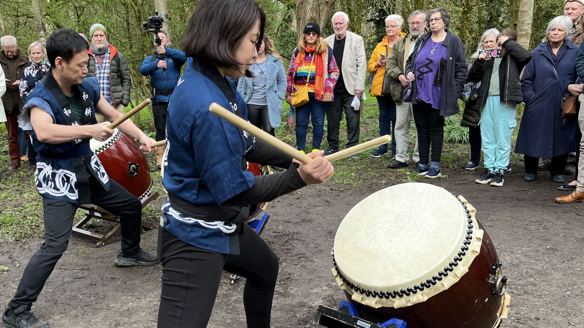 Two Japanese drummers playing their drums to the crowd that gathered on the bank of the river Marden