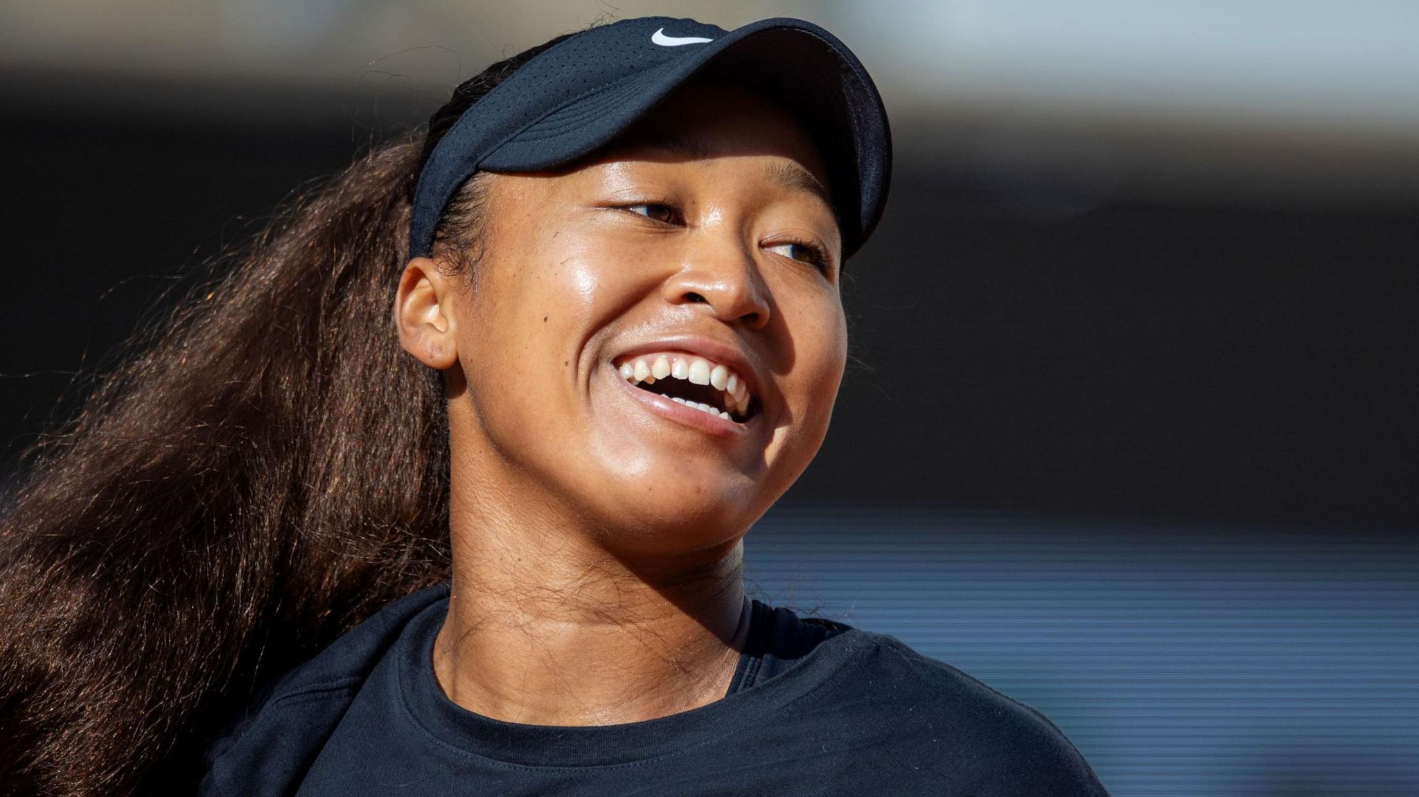 Naomi Osaka laughs during French Open practice