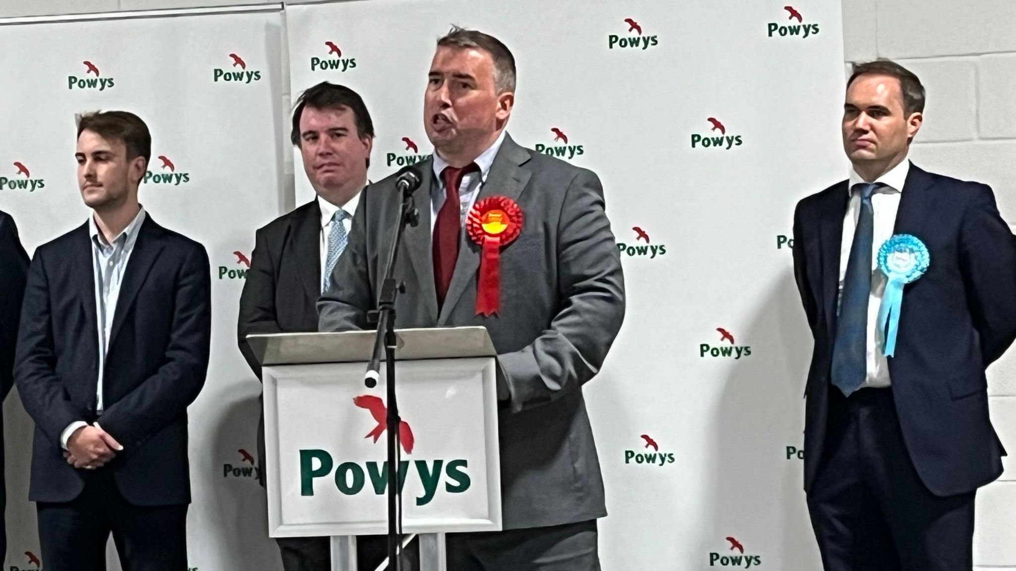 Craig Williams, the defeated former Conservative MP, watches Labour winner Steve Witherden at the election count