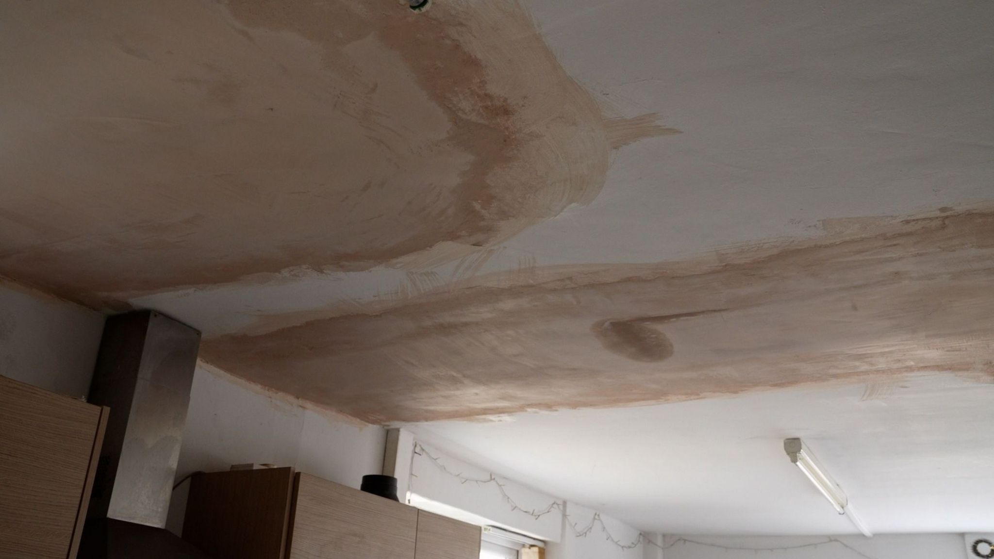 plastering in Elin's house appearing an entirely different colour and texture to the ceiling around it