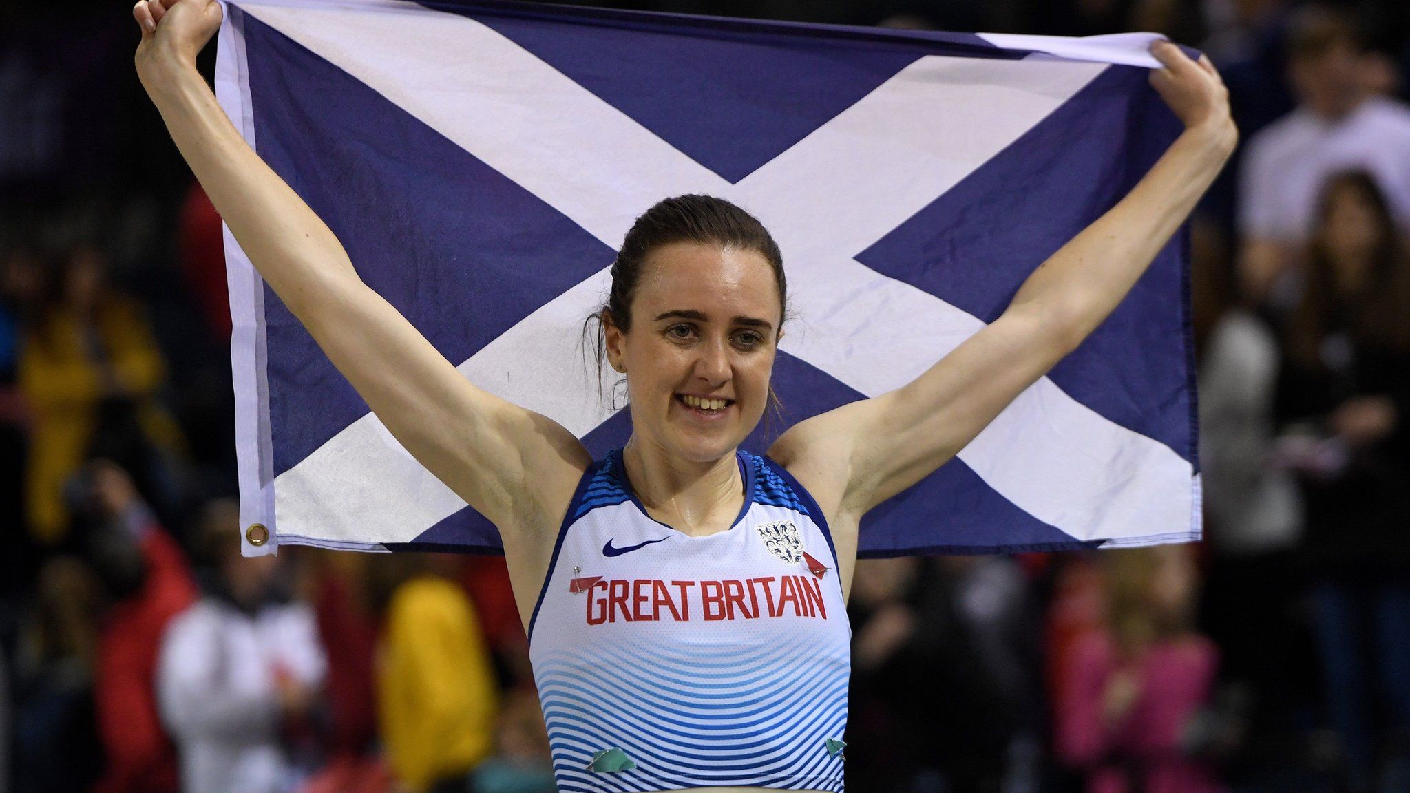 Britain's Laura Muir poses with a Scottish Saltire flag after taking first place during the women's 1000m final at the Müller Indoor Grand Prix Glasgow 2020 athletics in Glasgow on February 15, 2020.