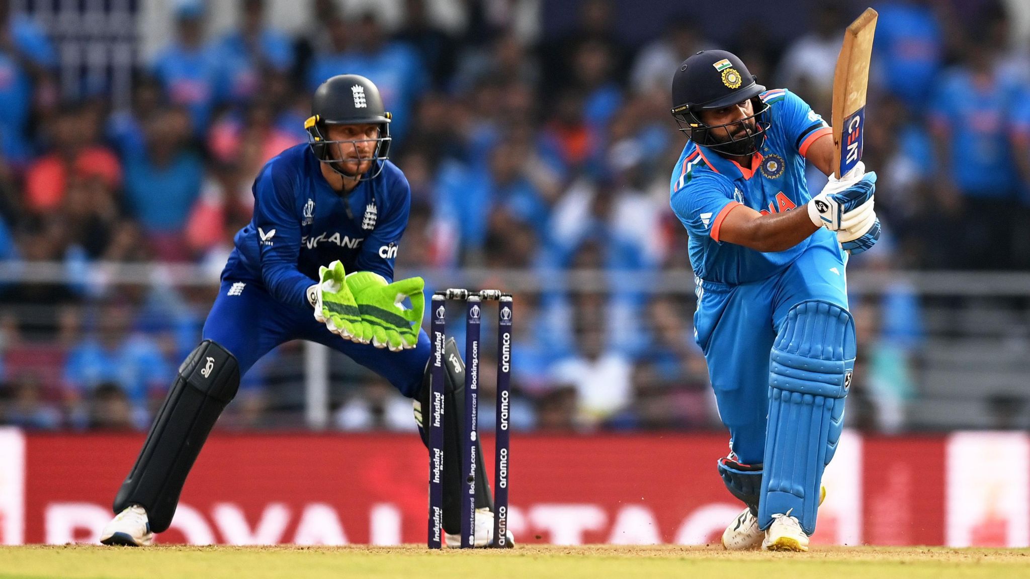 India captain Rohit Sharma bats while England captain Jos Buttler keeps wicket