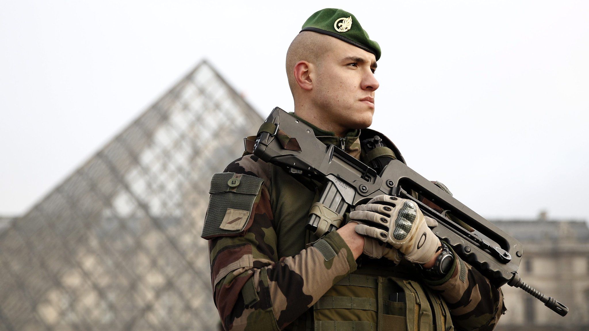 A soldier guarding The Louvre in Paris