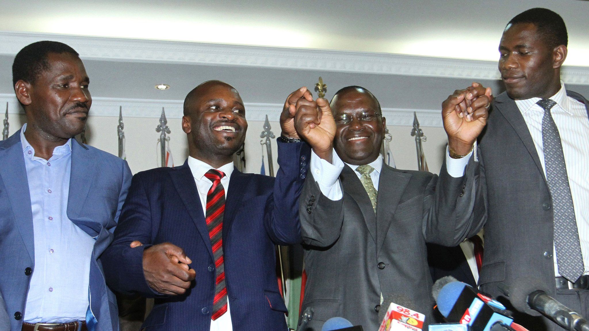 Kenyan civil servants celebrate signing a return to work after a long strike