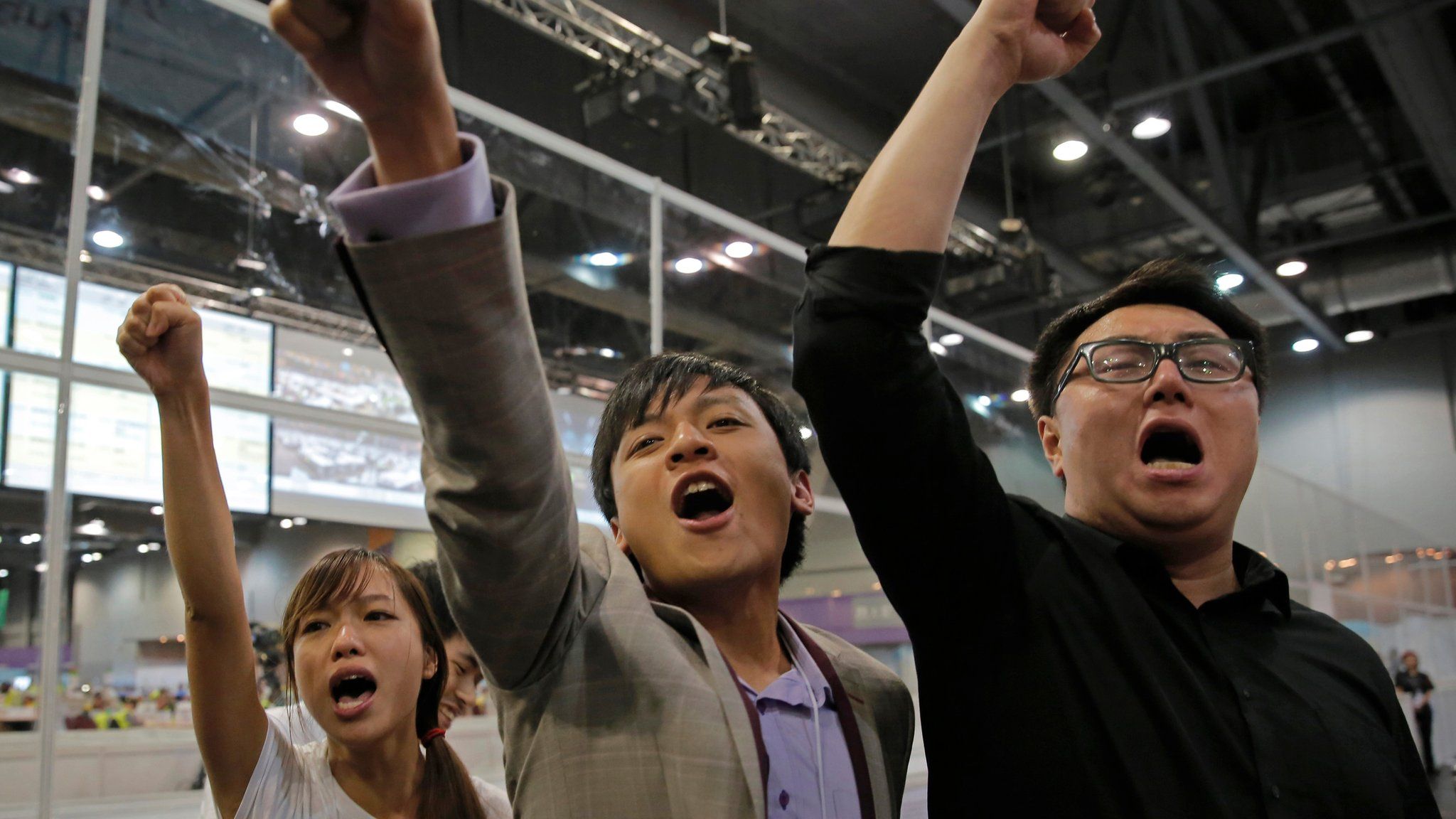 Candidates from Youngspiration celebrate after the party wins seats in the Hong Kong LegCo elections (5 September 2016)