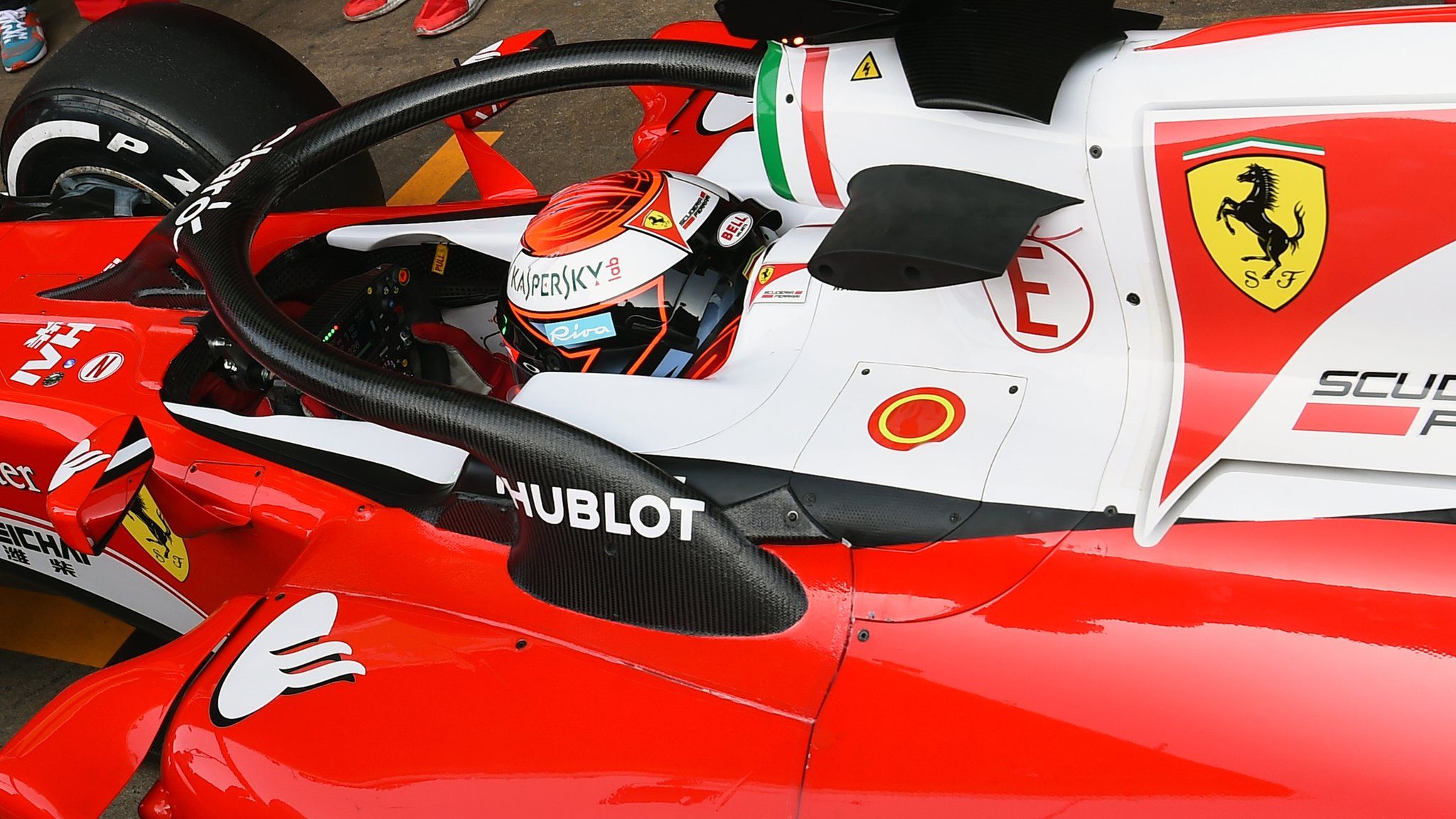 Ferrari's Kimi Raikkonen tests the new halo head protection system