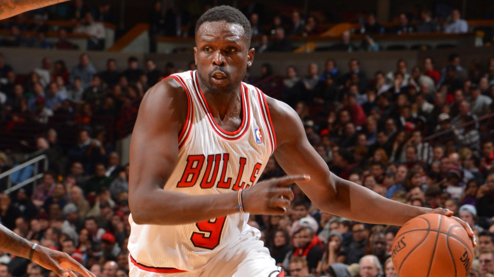 Luol Deng dribbles a basketball during his time with the Chicago Bulls