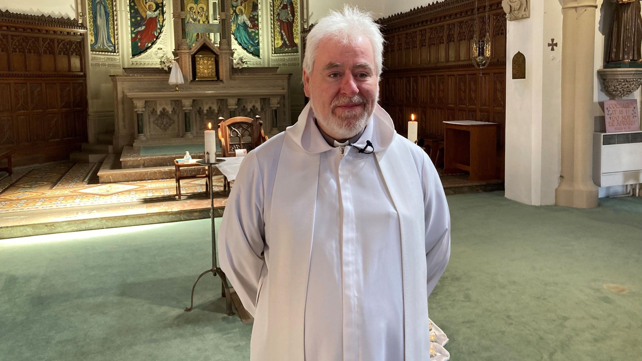 Father John Heneghan in church