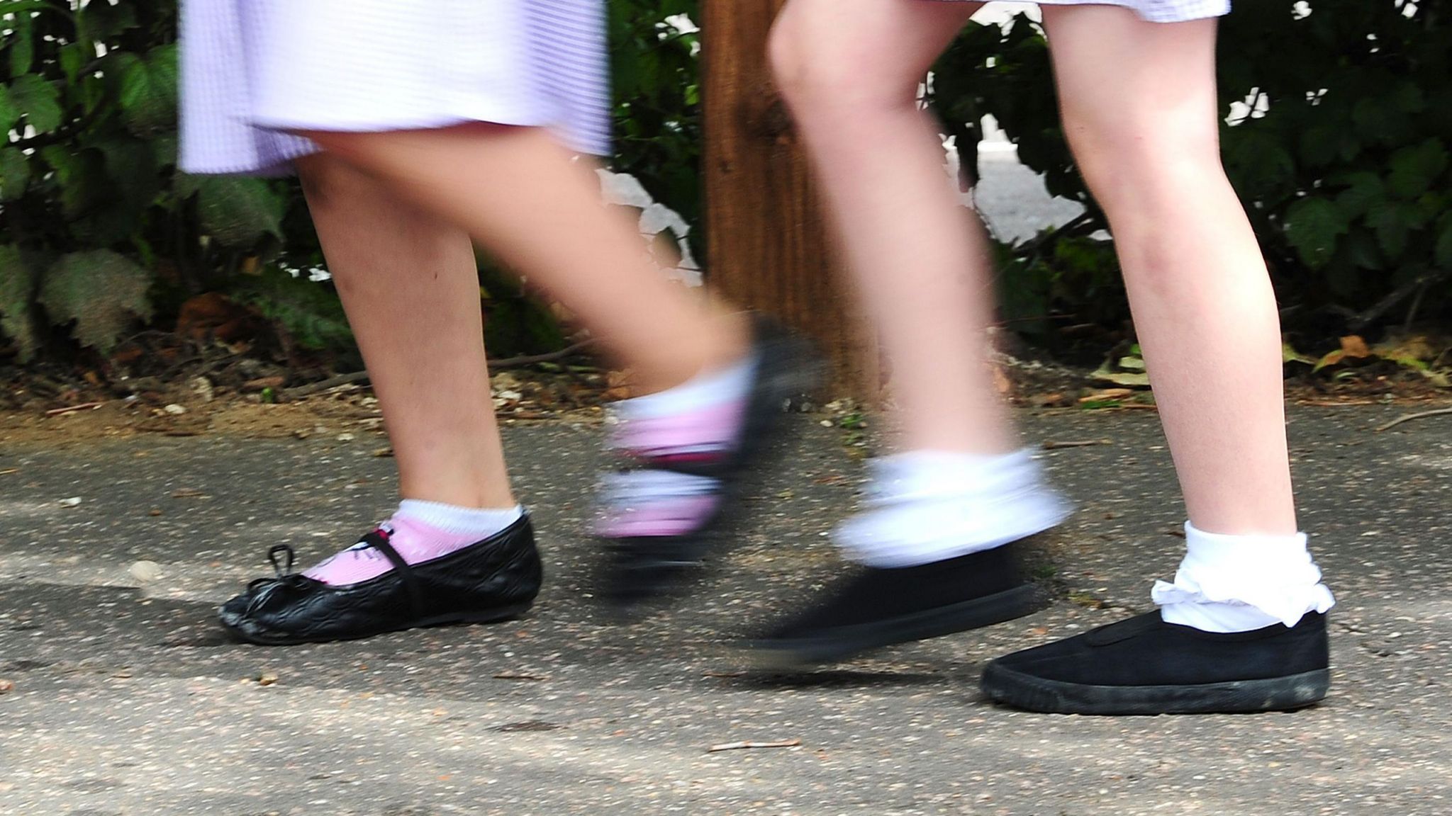  generic stock photo of school girls walking to school