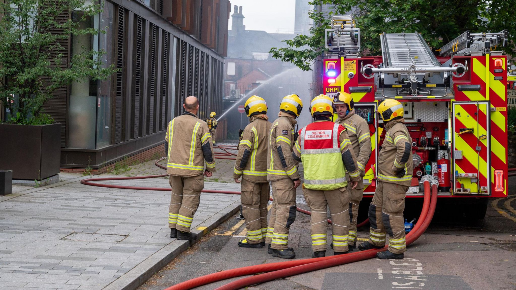 Six fire crews standing by the disused bar and a fire engine