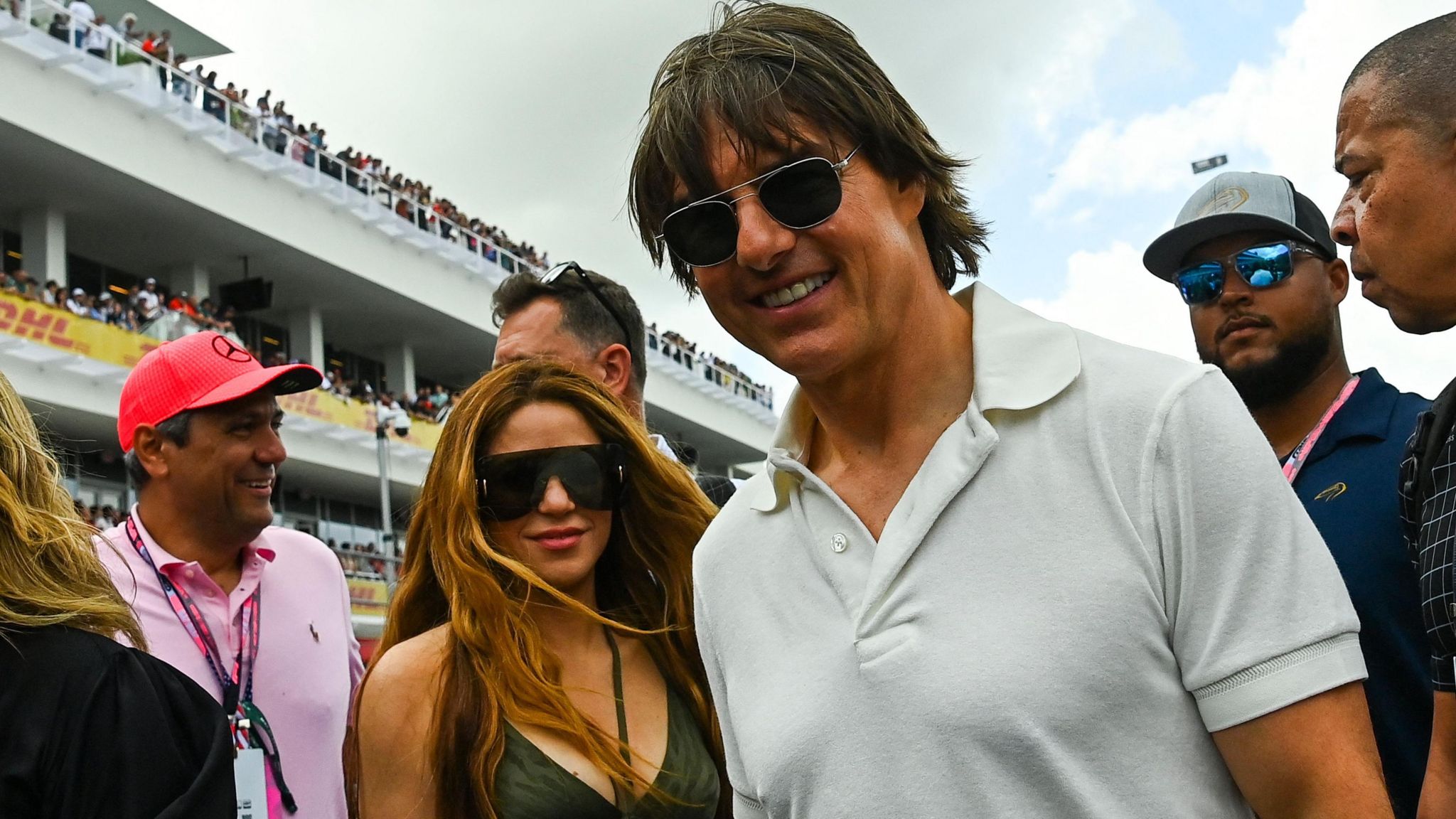 Actor Tom Cruise and singer Shakira pose for a photograph on the grid at the 2023 Miami Grand Prix