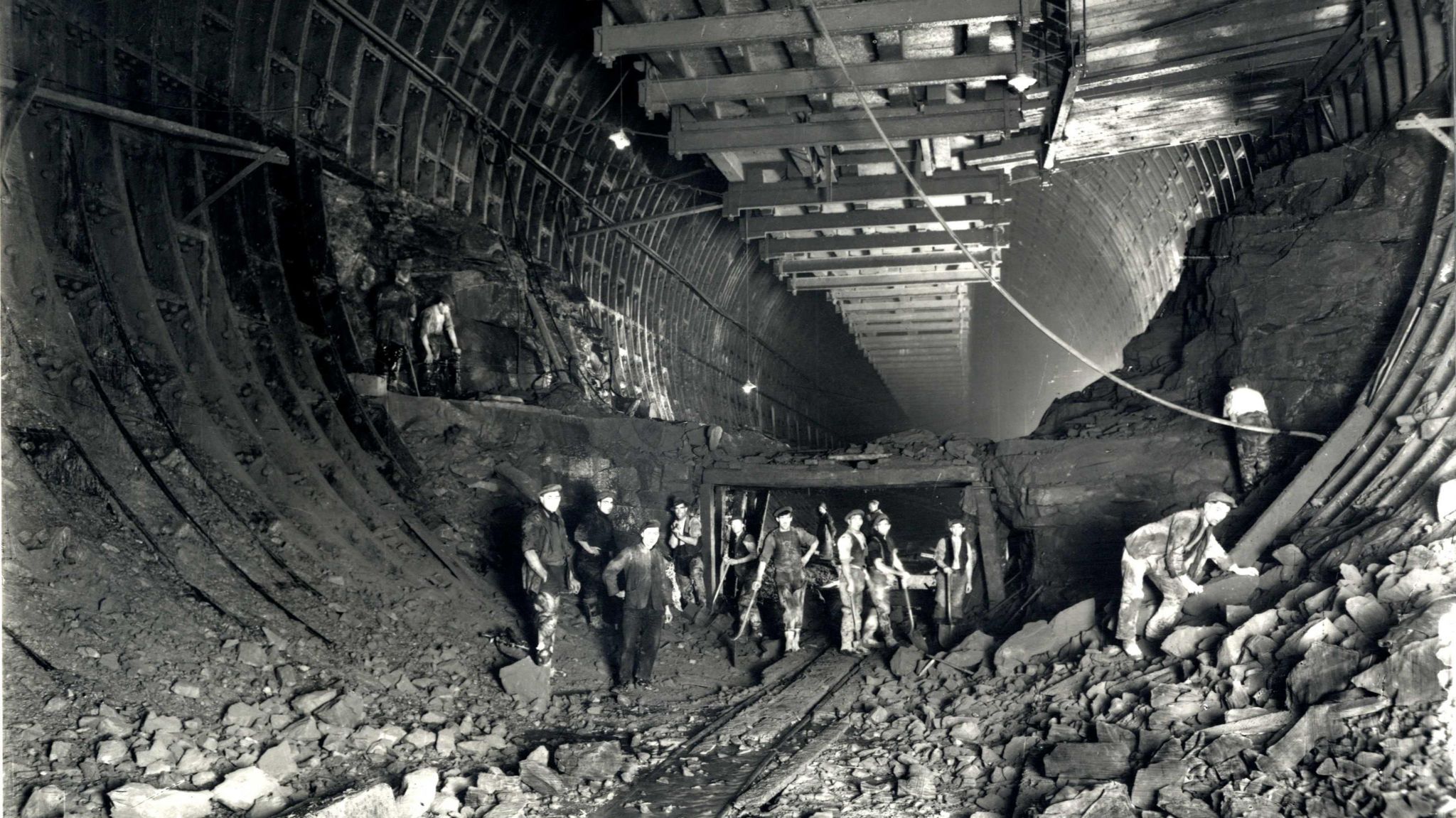 Workers pictured in the depths of the tunnel during building work