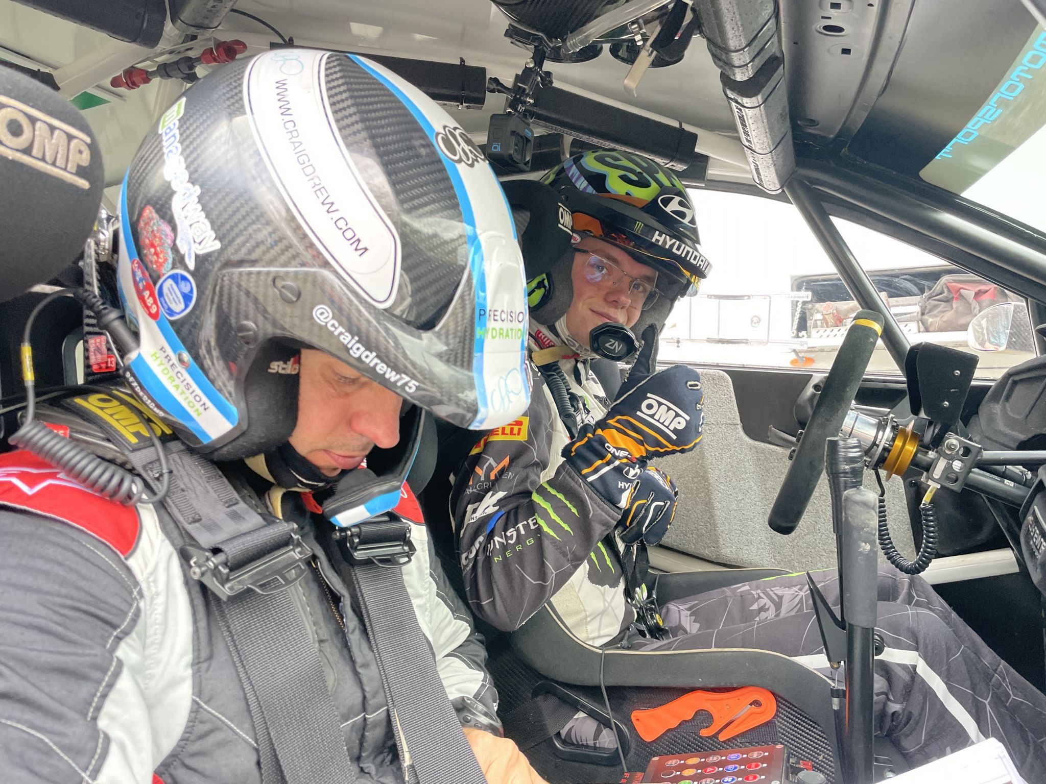 Oliver Solberg behind the wheel of a VW Polo rally car at the Cambrian Rally, with co-driver Craig Drew in foreground