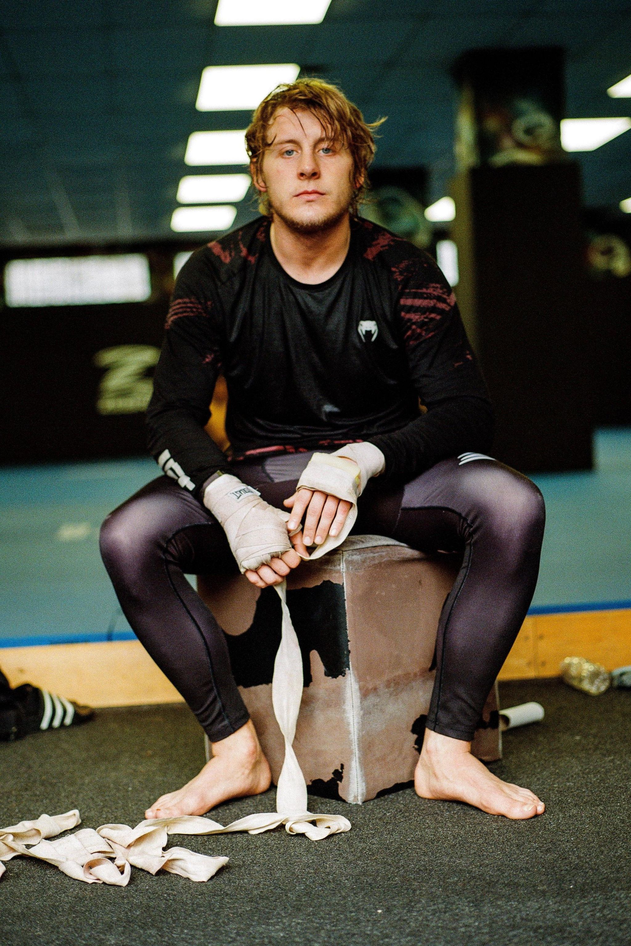 Paddy Pimblett takes off his hand wraps in his Liverpool gym