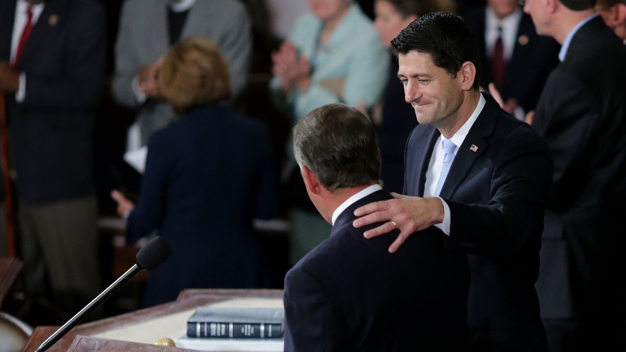 Speaker-elect of the House Paul Ryan (R-WI) shakes hands with outgoing U.S. Speaker of the House Rep. John Boehner (R-OH) in the House of Representatives chamber at the U.S. Capitol October 29, 2015