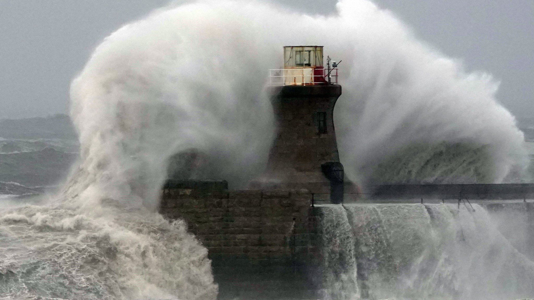 Waves crash against South Shields lighthouse