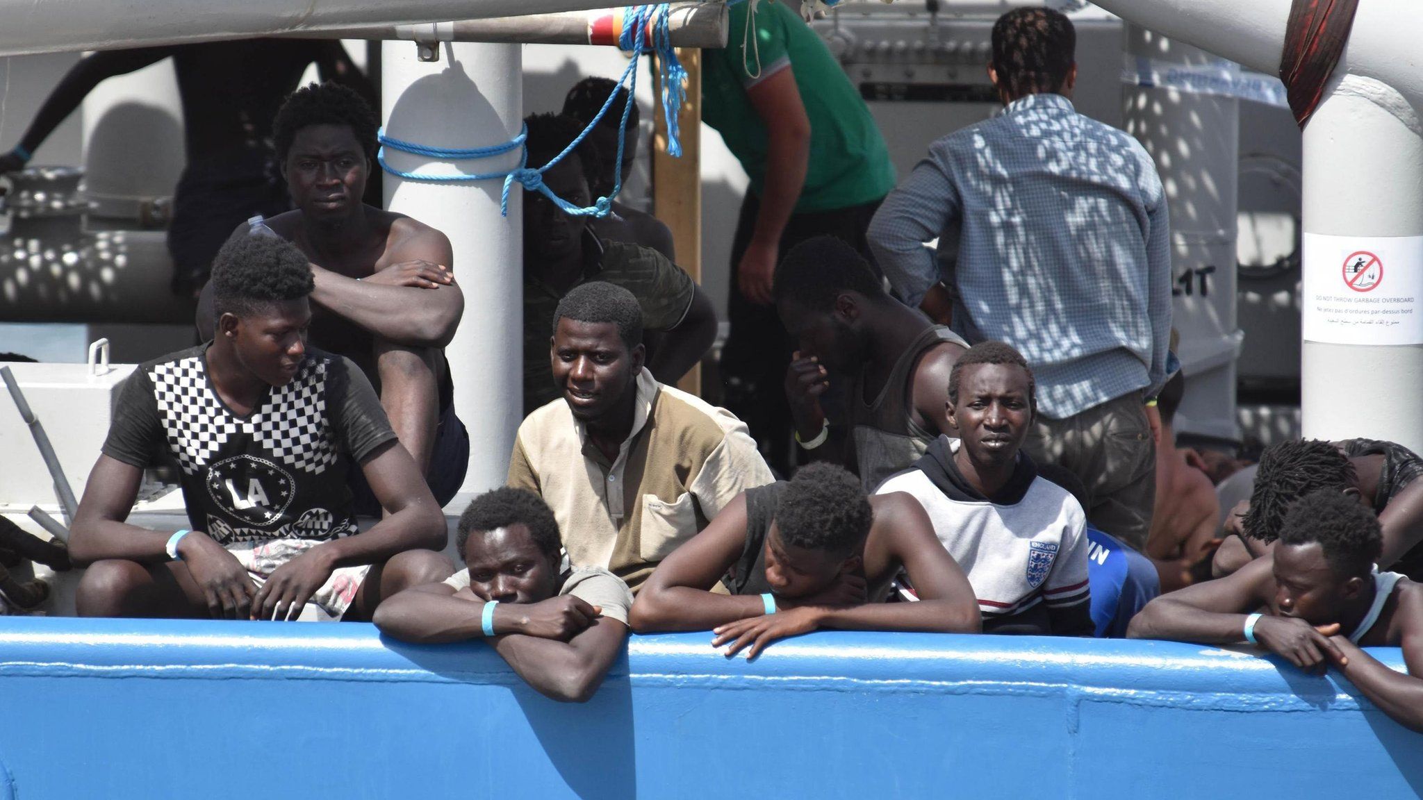 Some of the 650 migrants who were rescued by the Swedish ship Frontex in Mediterranean Sea off the Libyan coast, wait to disembark in Catania, Italy, 01 July 2017