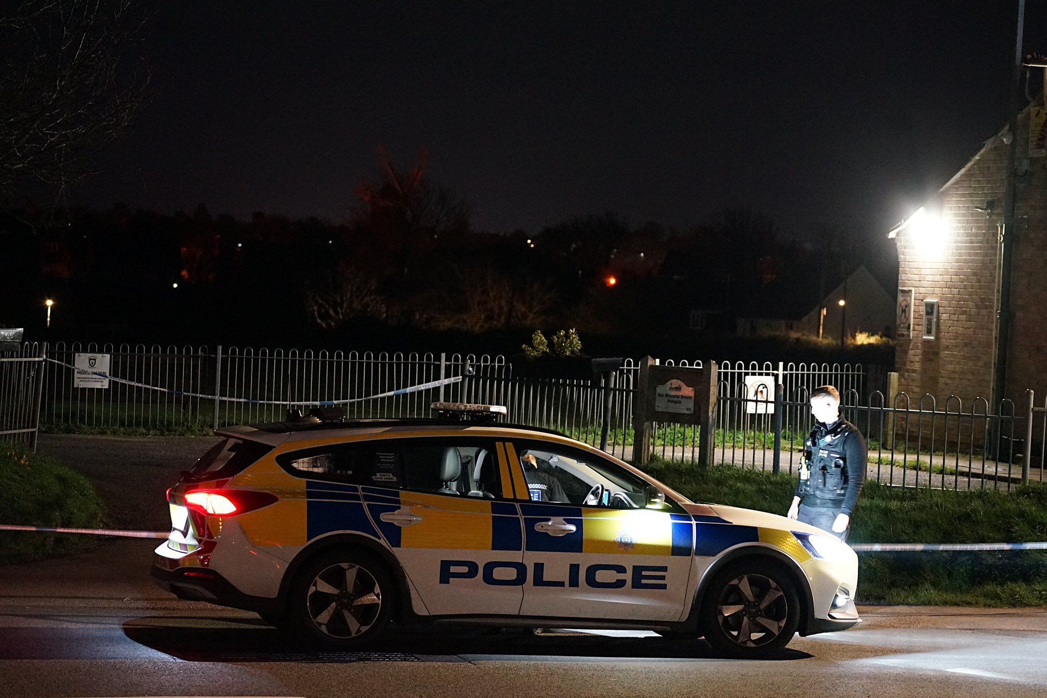 A police officer by a car