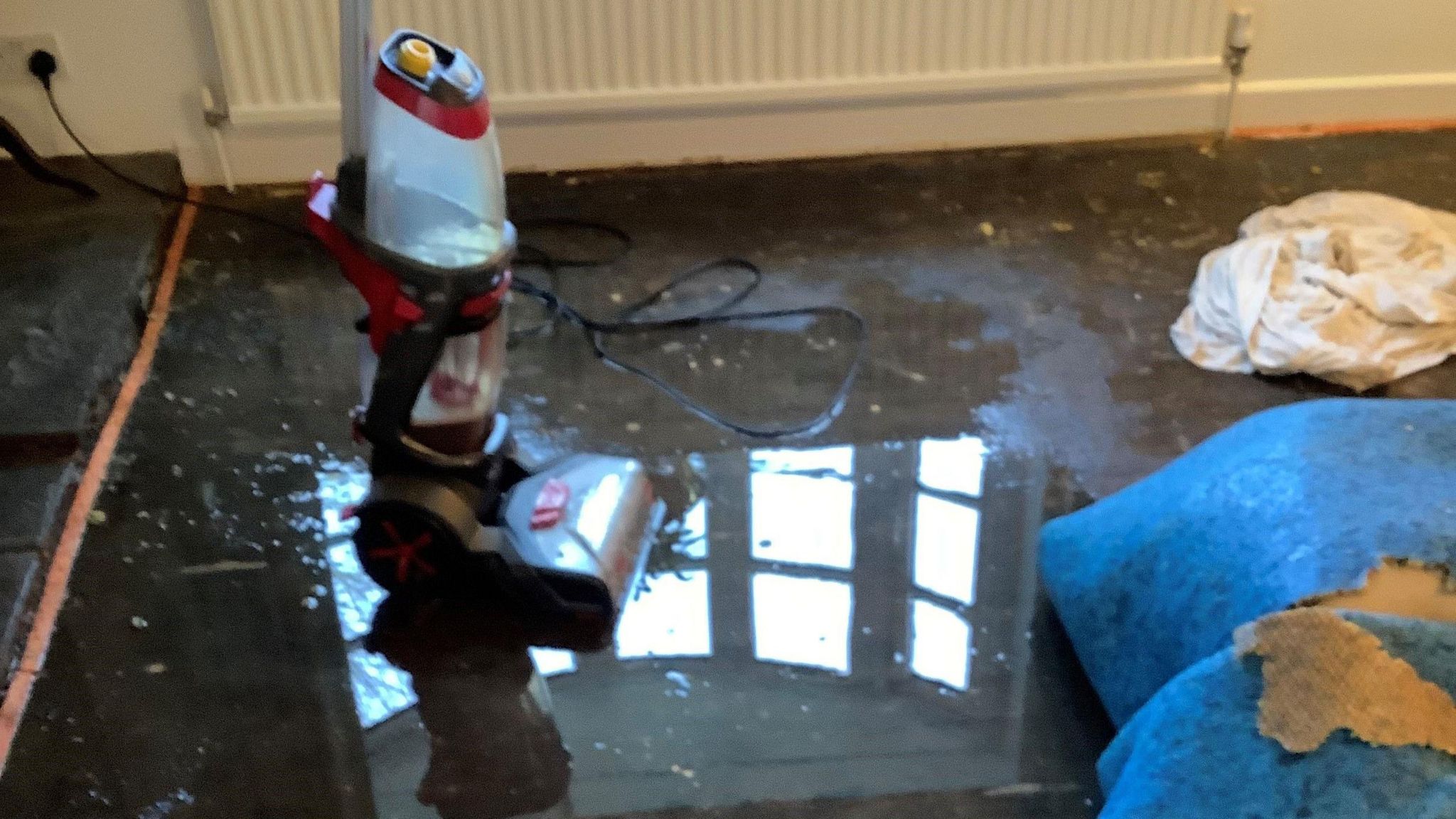 Flood waters in Simon's home showing a soaked carpet