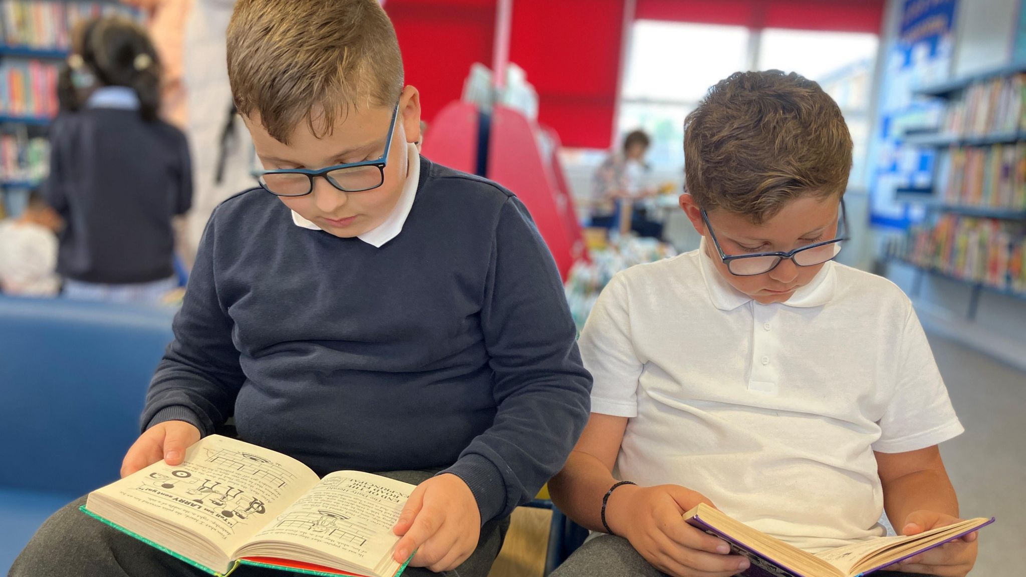 Matei and Lucas, both eight, reading at Hornchurch Library