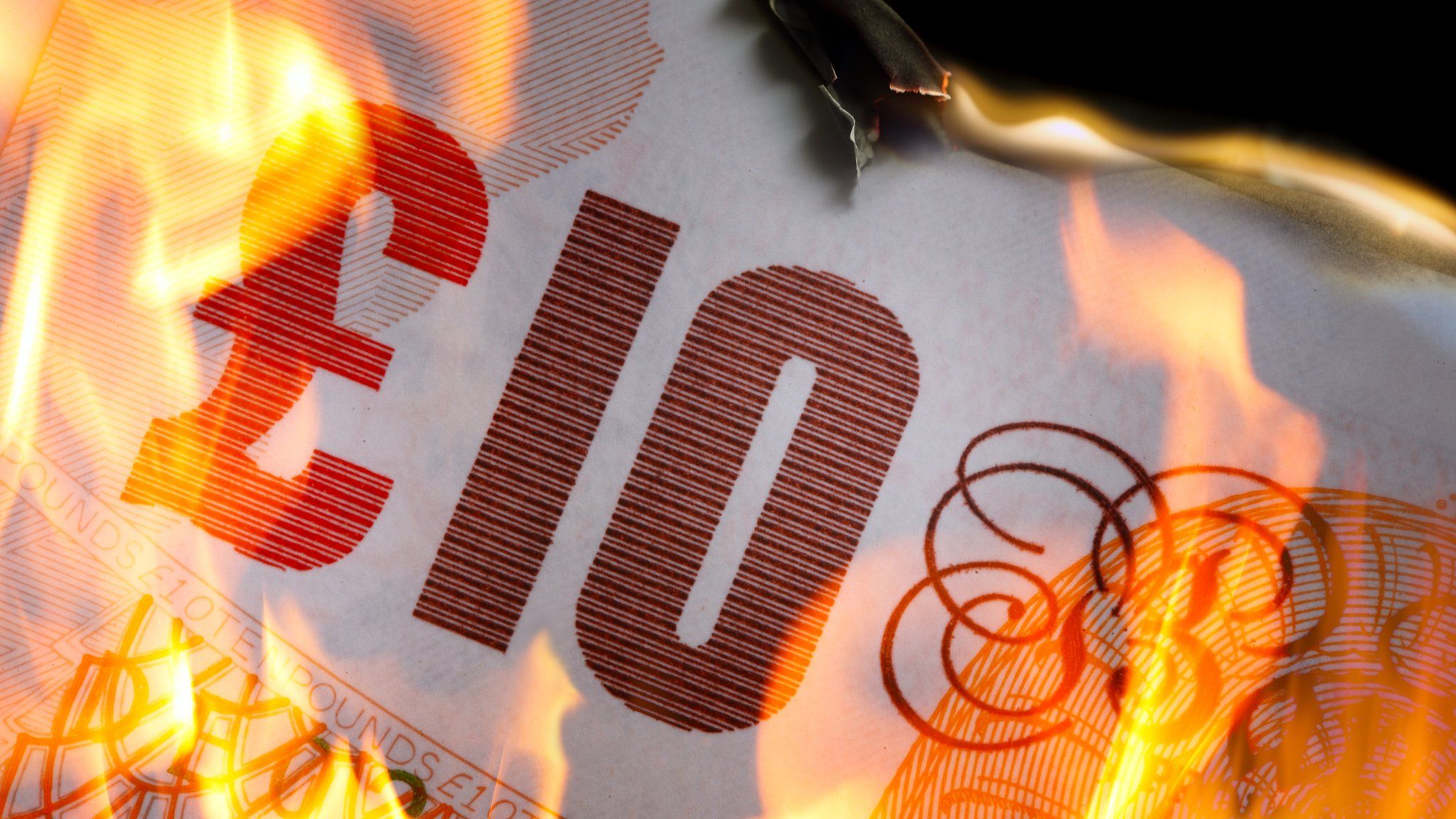 £10 note on fire