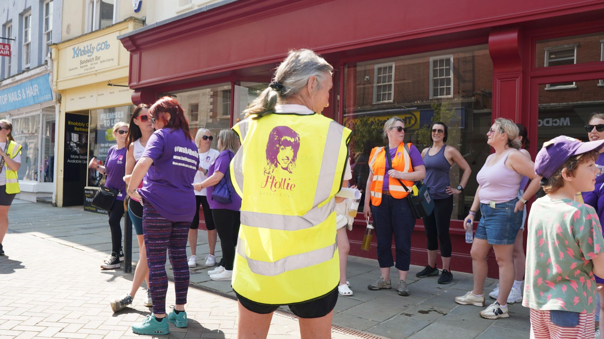 People walking through Gloucester city centre in memory of Hollie Gazzard