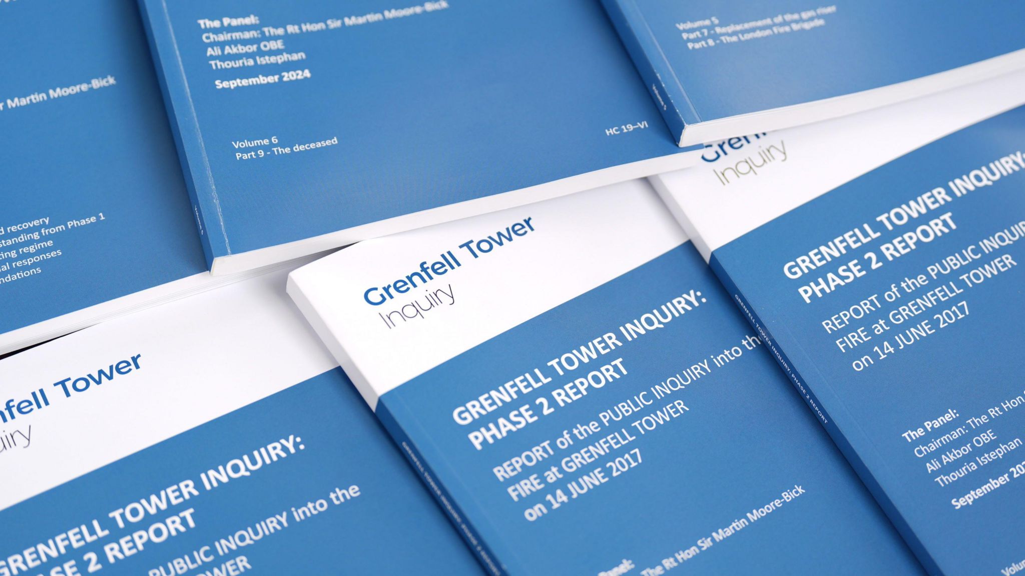 A photo shows a number of the Grenfell Tower Inquiry's final report.