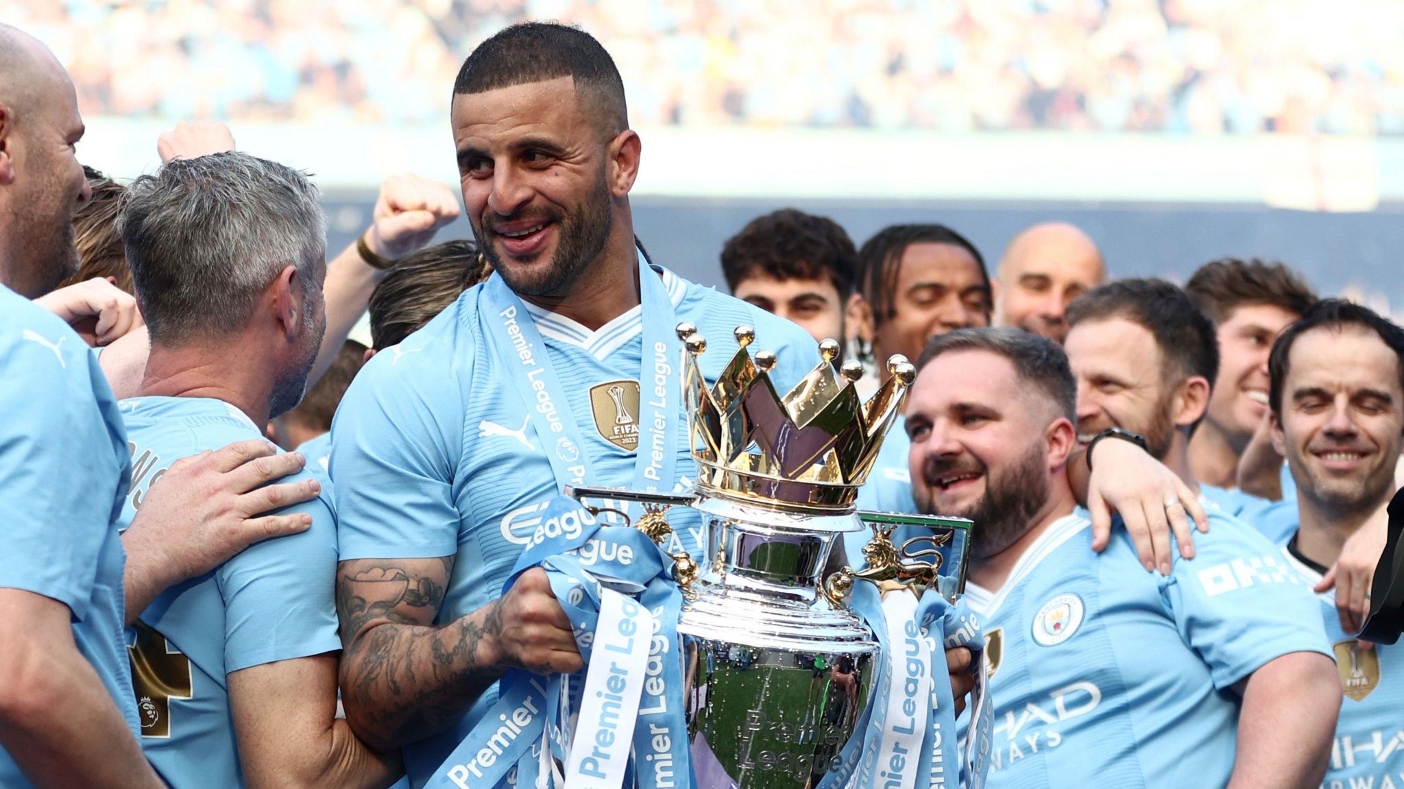 Kyle Walker holds nan Premier League trophy aft winning it pinch Manchester City