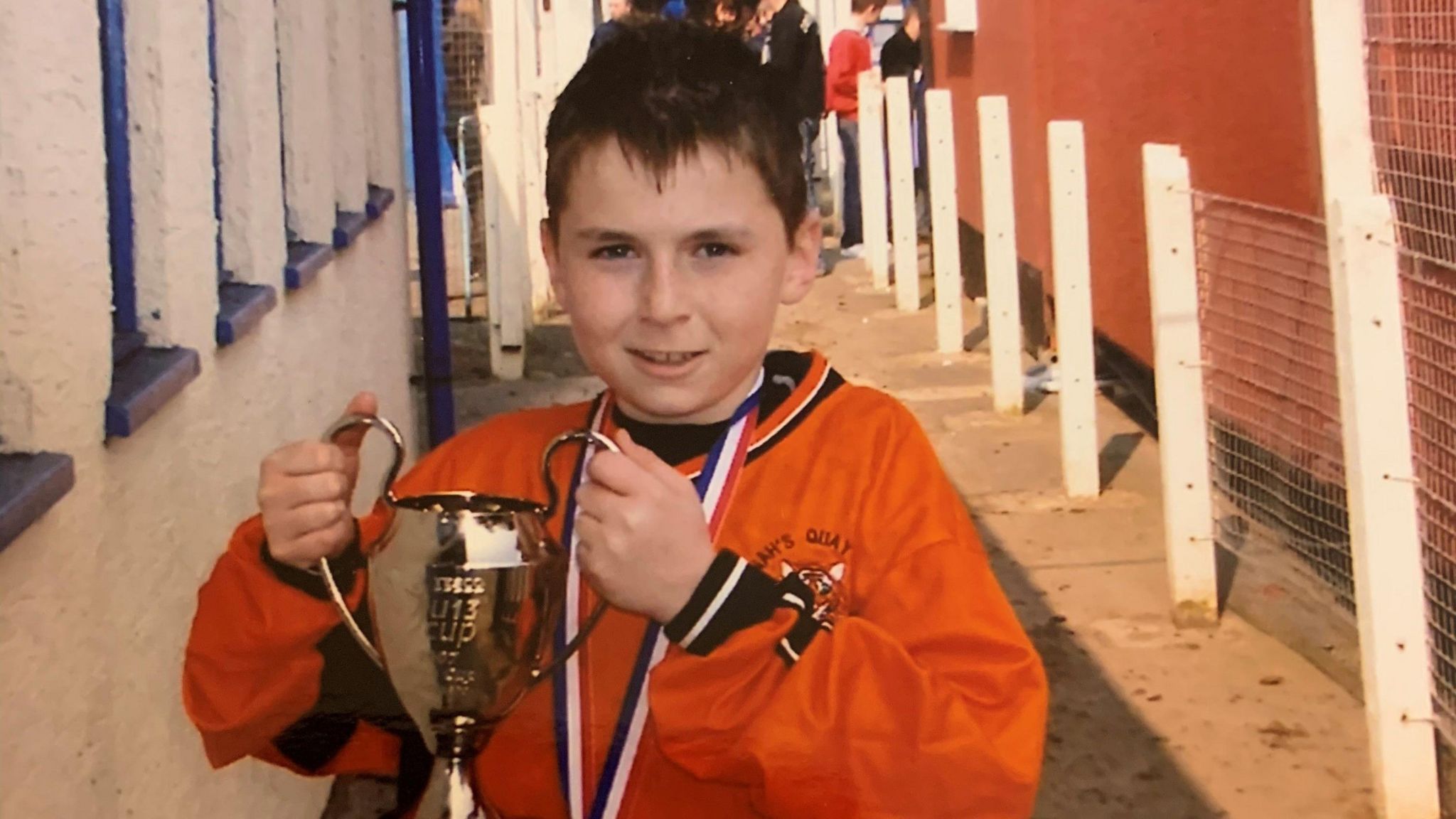 Jack Sargeant holding a trophy after winning the NWCFA Under-13s cup with Connah’s Quay Tigers