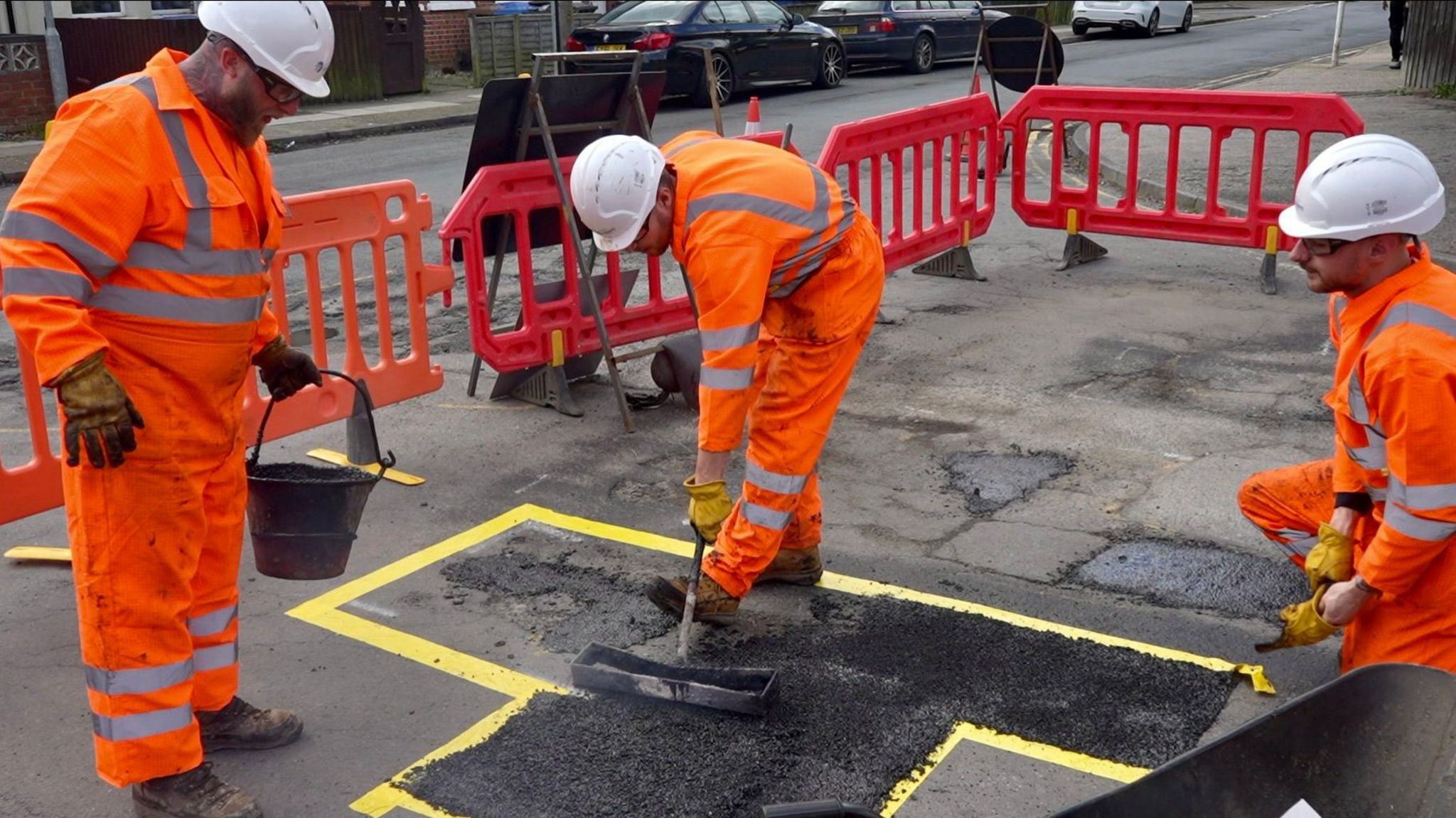 Suffolk highways workers mend a pothole in Ipswich