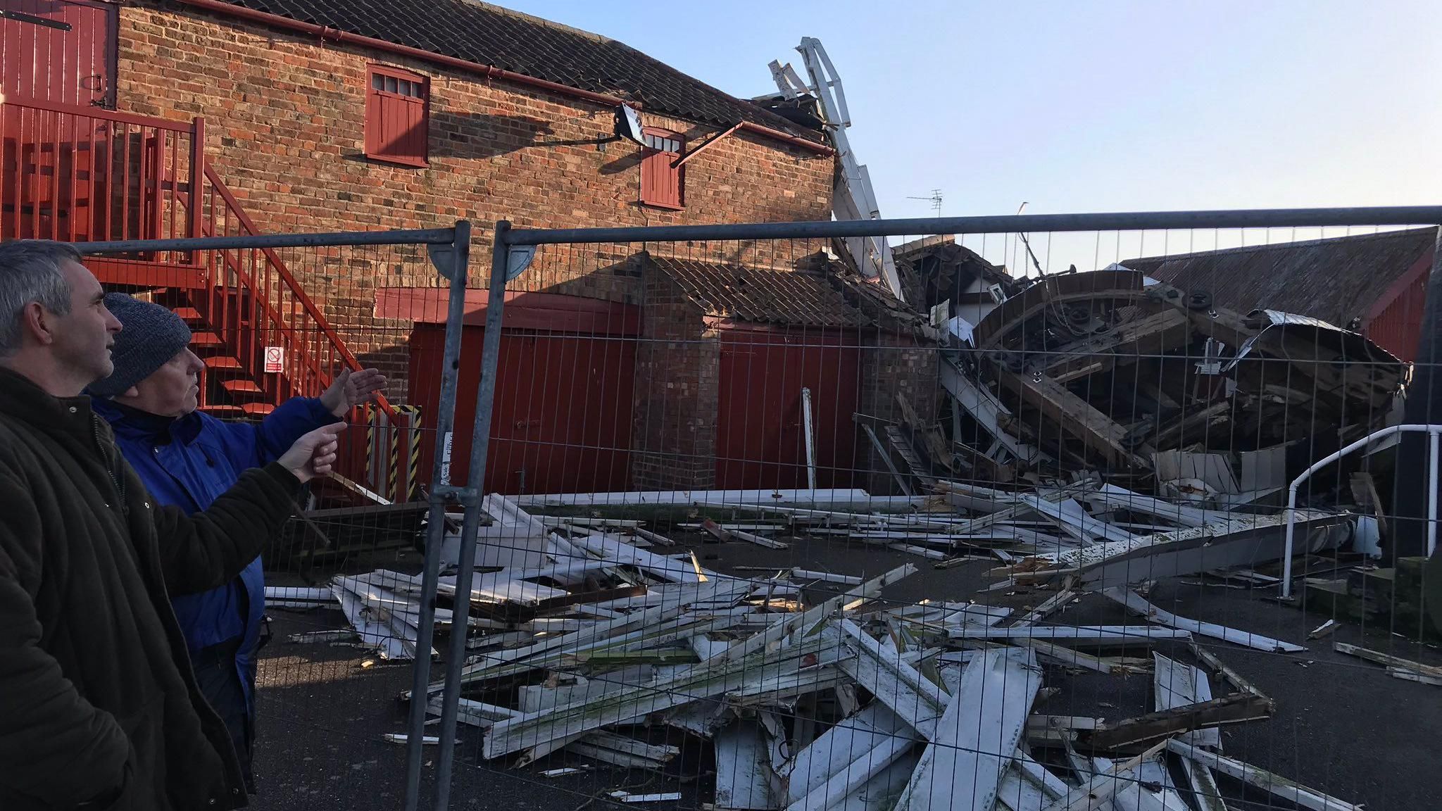 Richard Dobson with wreckage from the mill